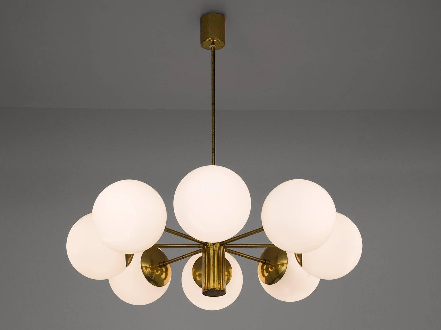 Sputnik chandelier, in brass and opaline glass, Europe, 1970s. 

This single layered Sputnik has eight wonderful glass globes. The chandelier consists of a brass fixture with eight arms, all with an opal sphere. Due the frosted glass these lights