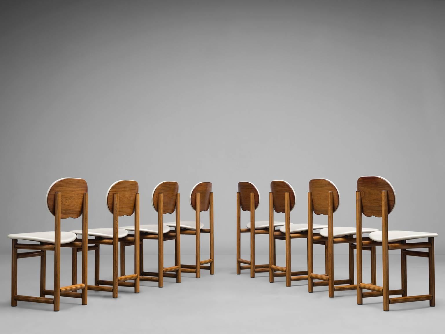 Eight dining chairs model 8104 by Afra and Tobia Scarpa for Maxalto, briar burl, lacquered wood, enameled steel, brass, Italy, circa 1975.

This set of chairs that is designed by Afra and Tobia Scarpa is a unique design by the designere couple. The