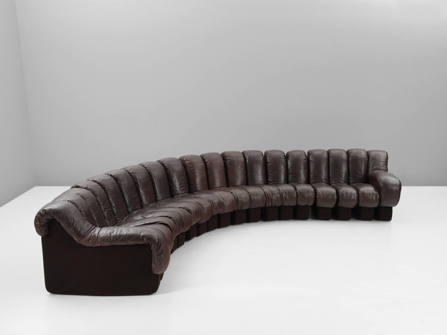 De Sede ‘Snake’ DS-600, in dark brown leather, Switzerland, 1972. 

De Sede 'Non Stop' sectional sofa containing 19 pieces in original dark brown leather, of which 17 center pieces and two armrests. Any number of pieces can be zipped together