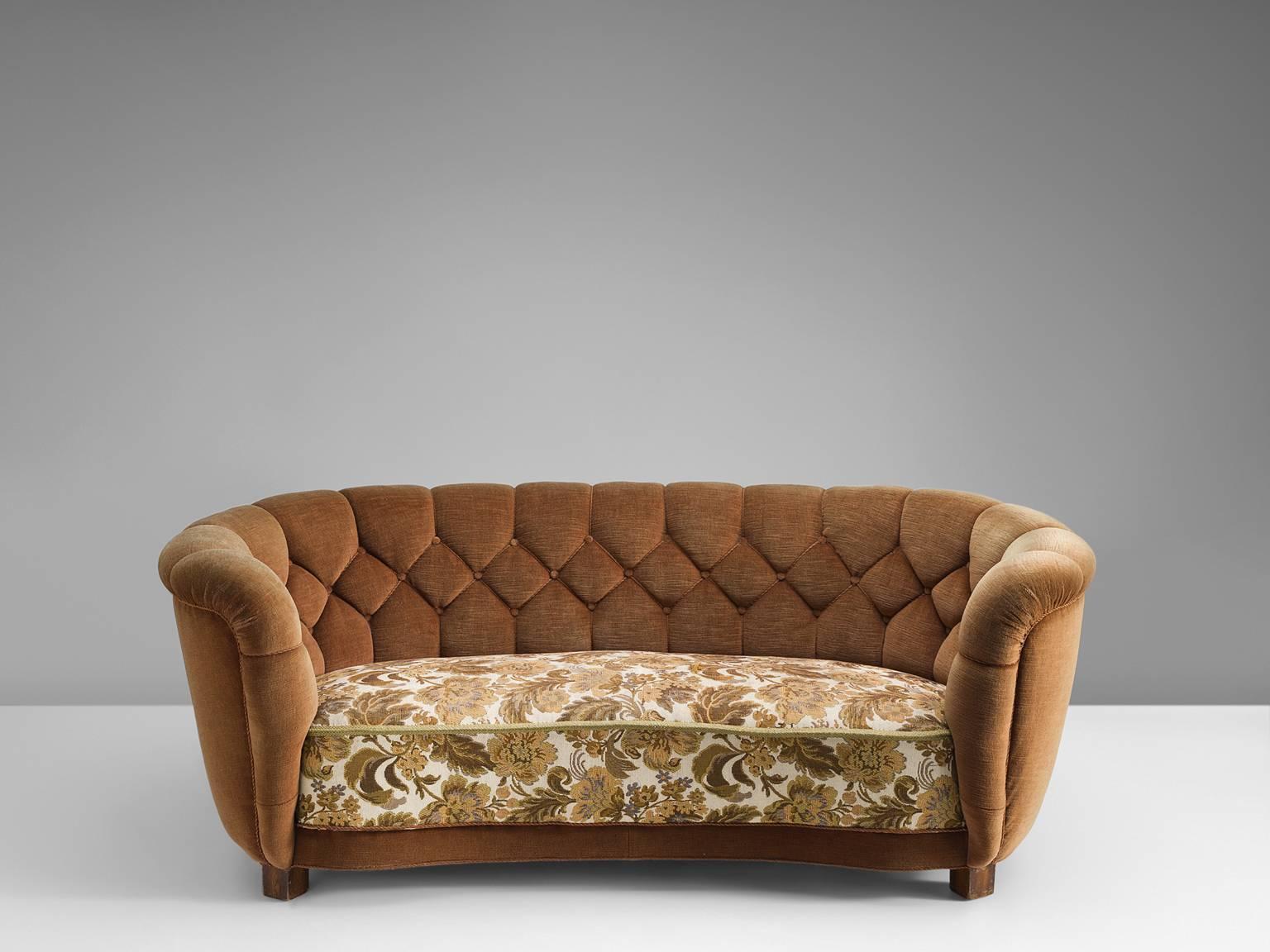 Sofa, fabric, wood, Denmark, 1950s.

This curved little sofa is well designed and proportioned. The thick seat and voluptuous quilted back are there to provide maximum comfort. The sofa is large in appearance but not in size. The original upholstery