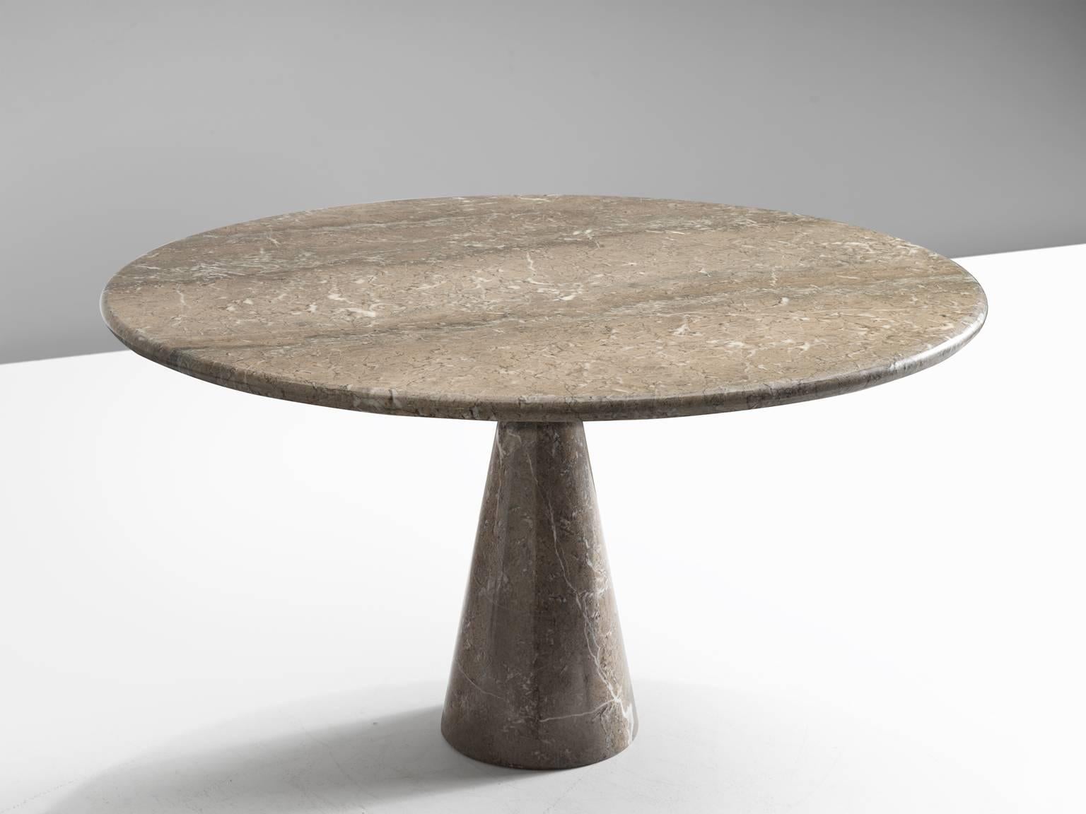 Dining table, marble, by Angelo Mangiarotti and made by the company T70, Italy, 1969

This solid grey table has a cone shaped base and a circular top. The circular top rests perfectly on the cone. The design showcases a play of balance and rhythm.