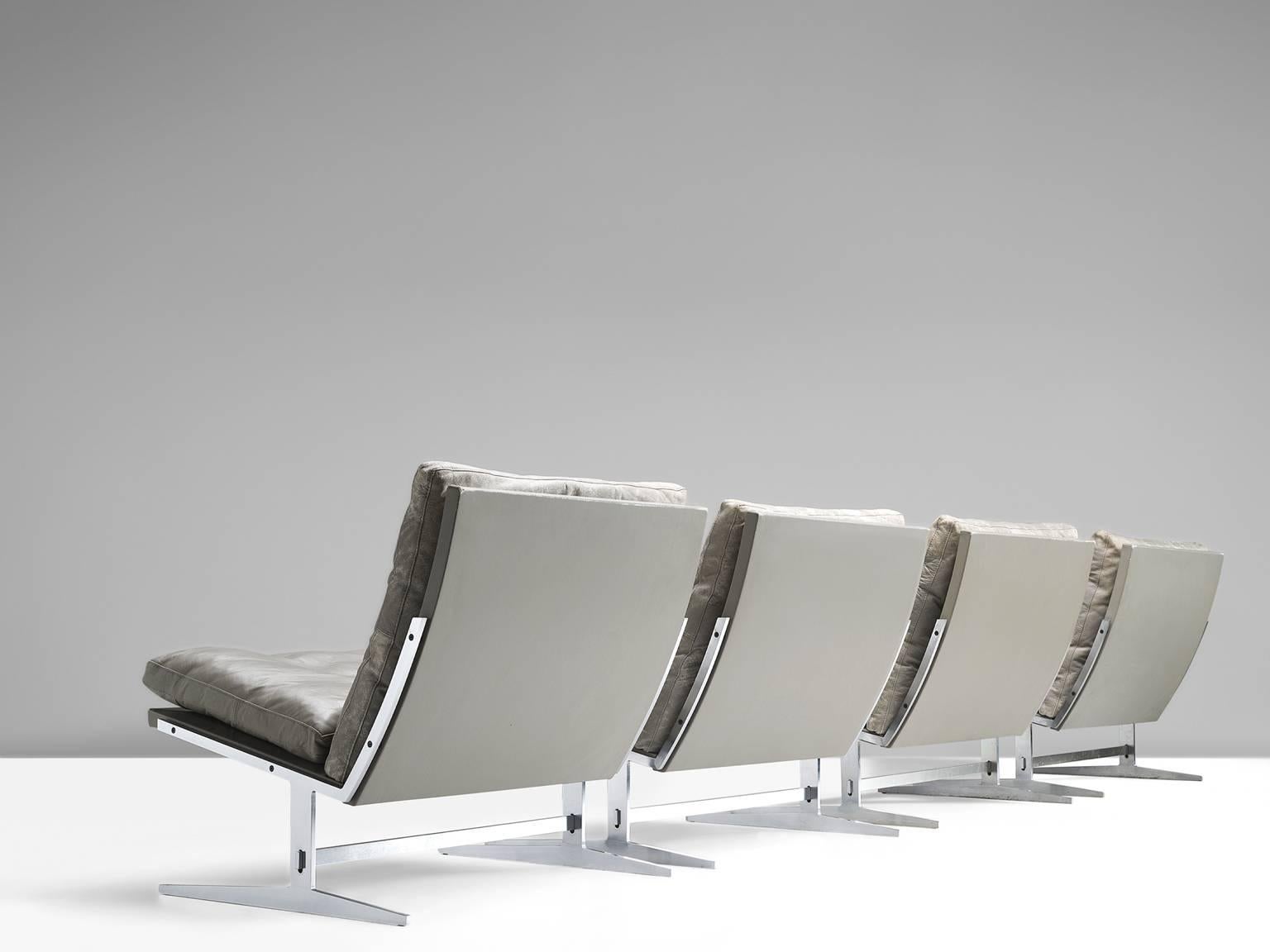 Four lounge chairs model BO561, in brushed steel and grey leather, by Preben Fabricius & Jørgen Kastholm, Denmark 1962. 

Set of four modern slipper chairs in steel and leather. These chairs hold an L-shaped seating. This shape is repeated in