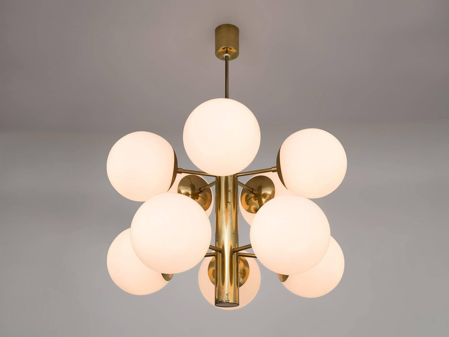 Sputnik chandelier, in brass and opaline glass, Europe, 1970s. 

This double layered Sputnik has ten wonderful glass globes. The chandeliers consist of a brass fixture with ten arms, all with an opal sphere. Due the frosted glass these lights