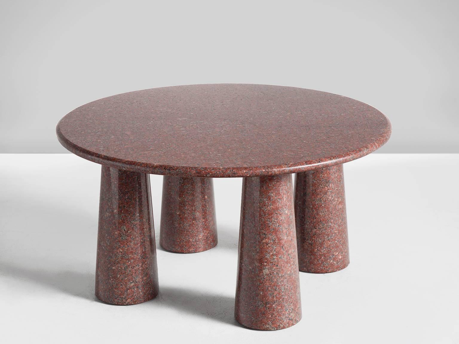 Circular red cocktail table, granite, 1970s, Italy

This small but solid table has a strong architectural features such as cone shaped legs. The circular top is small in comparison to the legs, giving this table a dense and strong look despite its