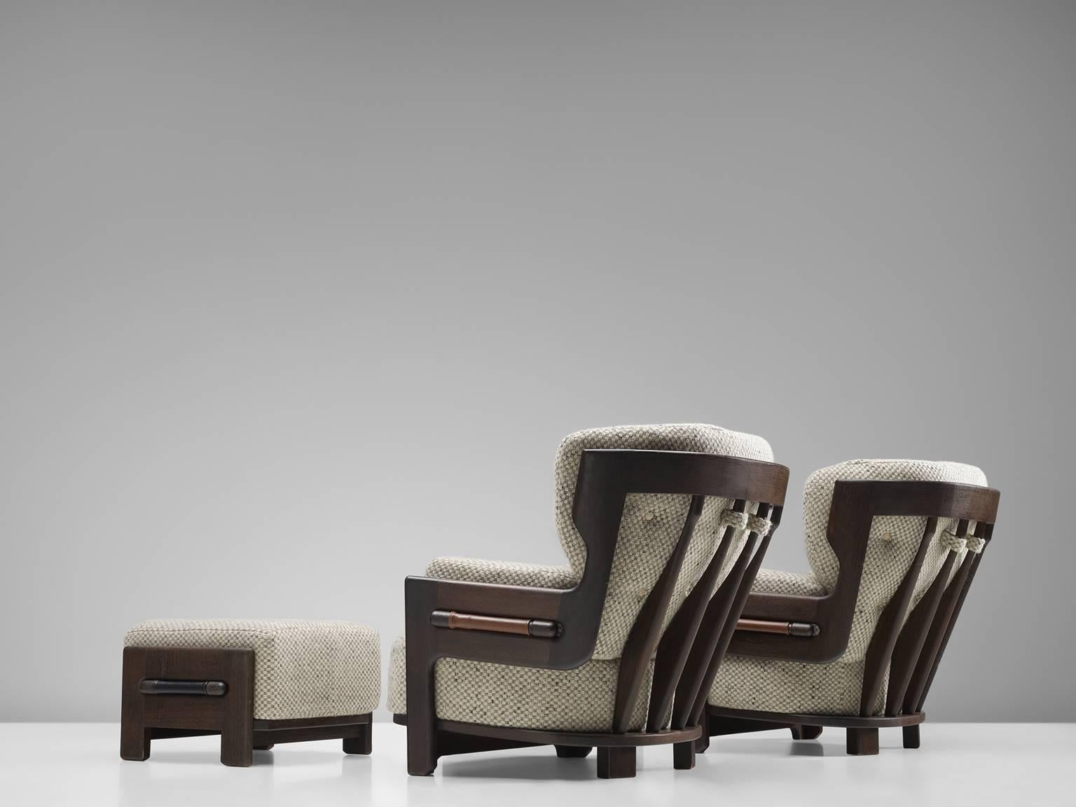 Set of two lounge chairs with ottomans oak and beige white fabric, by Guillerme et Chambron, France, 1940s. 

Set of two extraordinary Guillerme and Chambron armchairs with matching ottoman, in solid oak with the typical characteristic decorative