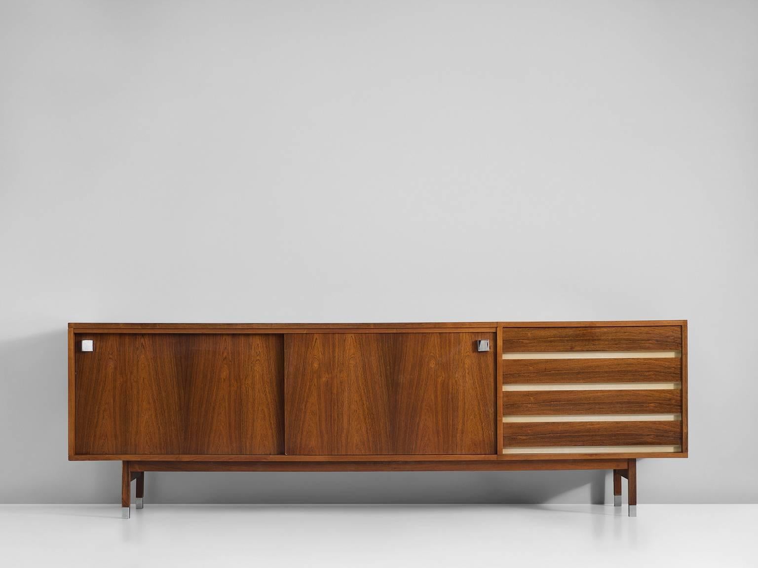 Sideboard in rosewood, by Alfred Hendrickx for Belform, Belgium, 1960s. 

Large sideboard in rosewood. This credenza consist of two sliding doors with characteristic black square metal handles. The design of this model is simplistic, with great