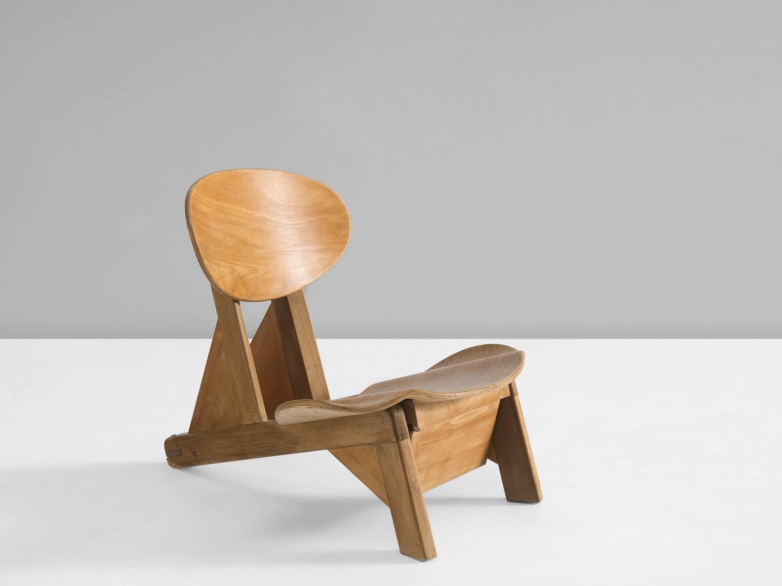Small chair by Alain Gaubert, beech and elm, France, 1950s. 

This small and adjustable chair is by the designer Alain Gaubert. The form of this chair is truly unique as the curved seat is rare for the designs of Gaubert. This early design by