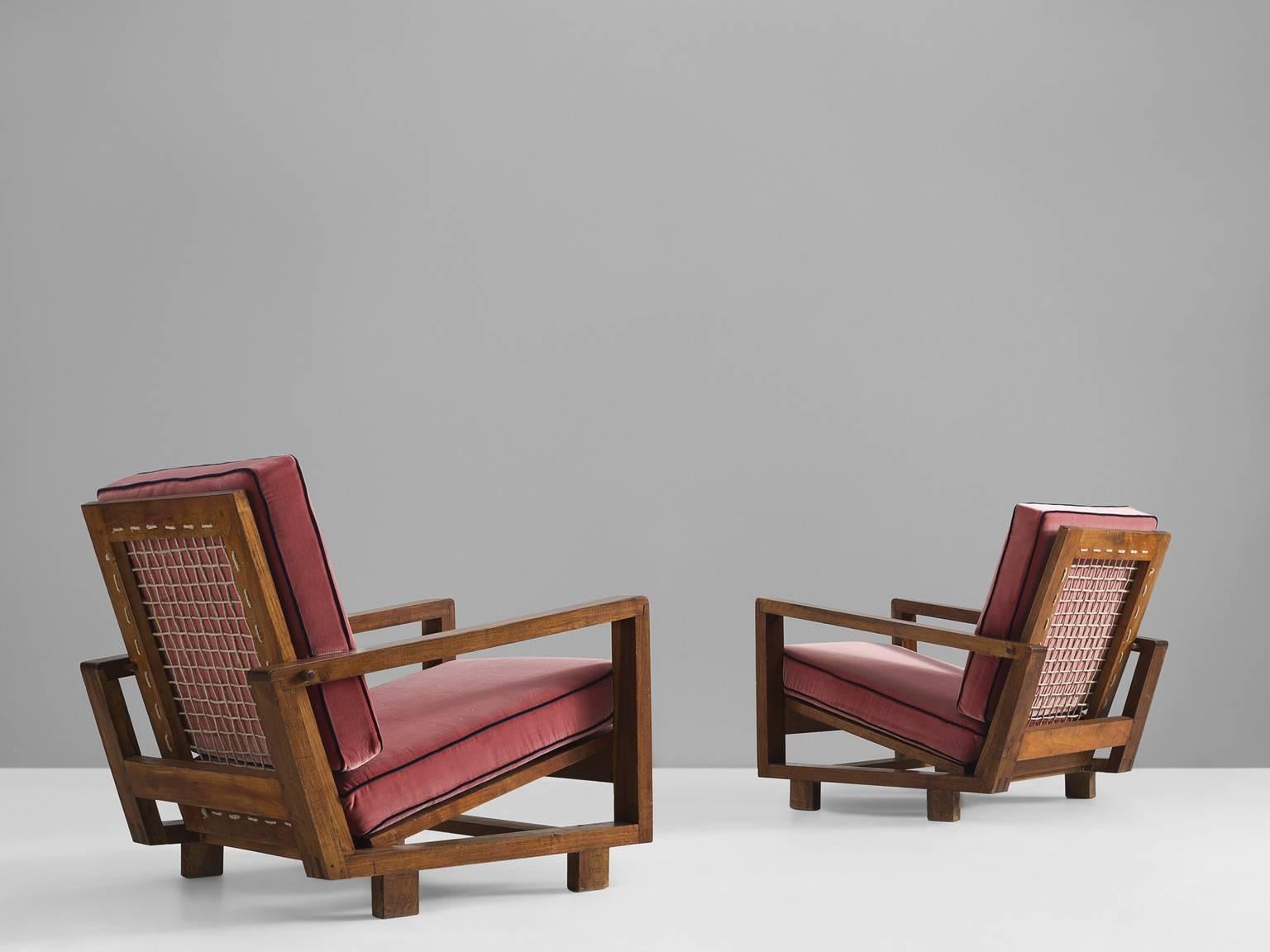 Lounge chairs, pink fabric, walnut, Italy, 1950s.

This set of reclining armchairs is both airy solid. The seat and back are recently upholstered by our in-house upholstery studio in pink velvet with navy blue piping. The wooden frame consists of