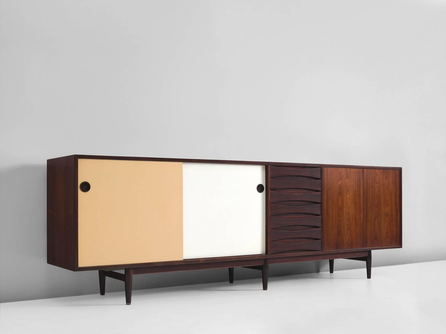 Credenza model 29A, in teak and wood by Arne Vodder for P. Olsen Sibast Møbler, Denmark, 1959.

Excellent sideboard in rosewood by Danish designer Arne Vodder. Typical highly refined details can be found on this sideboard, for example, the