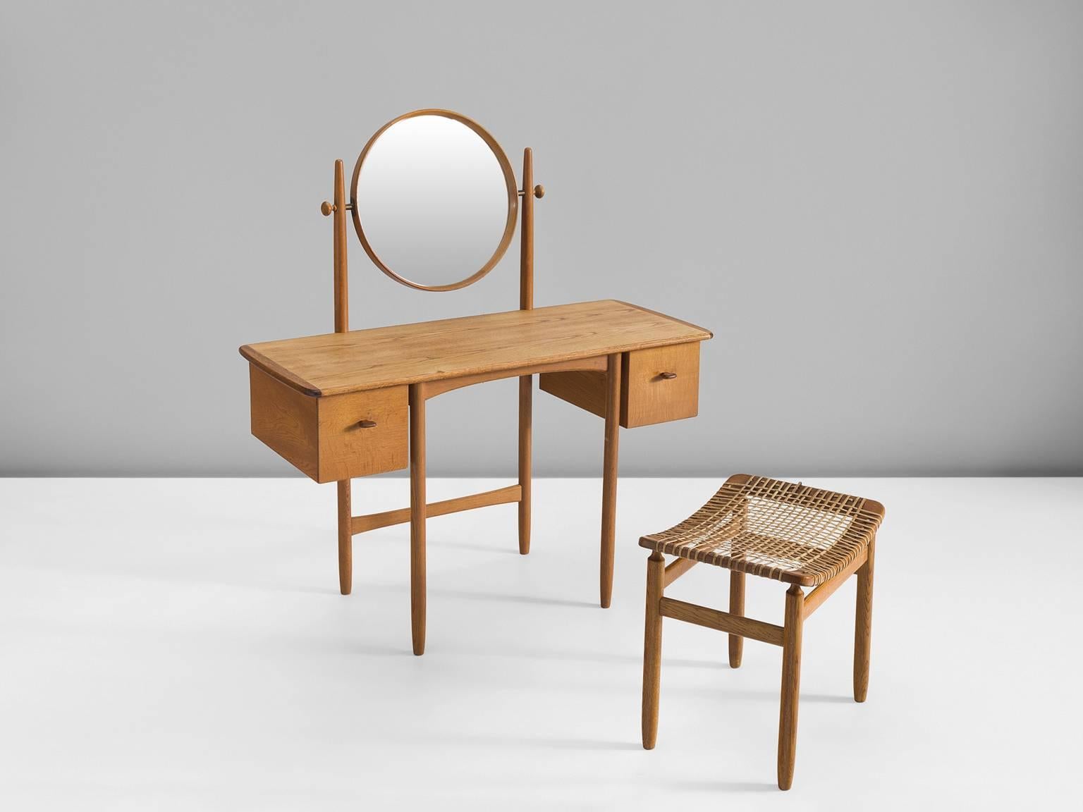 Dressing table with stool, teak, mirror and cane, by Sven Engström & Gunnar Myrstrand for Bodafors, Sweden, 1950s.

This set is wonderfully balanced. The dressing table itself shows refined detailing in joints, handles and finishes whereas the