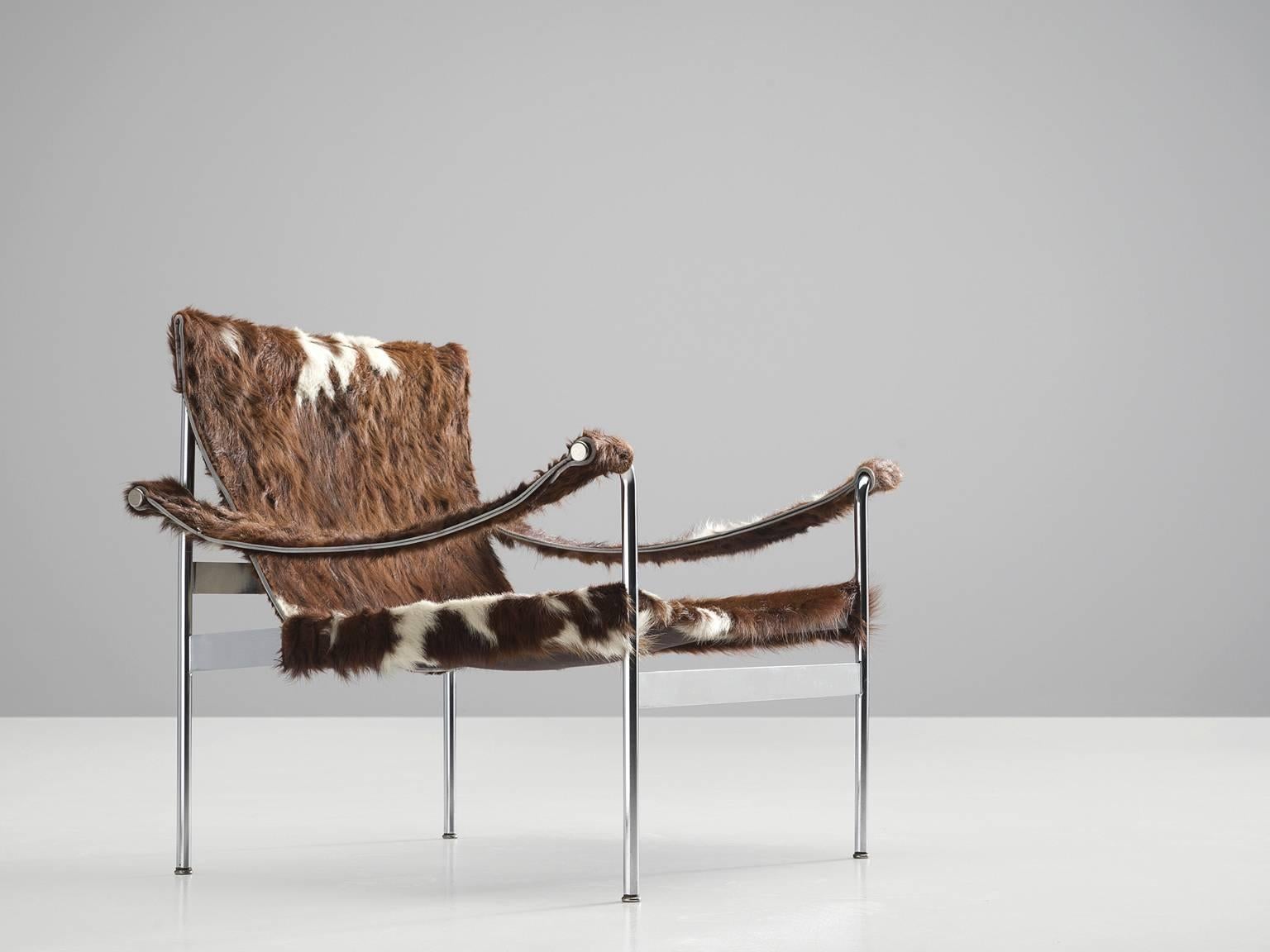 Cow hide lounge chair, D-99-L, designed by the architect and founder of company Tecta, Hans Könecke, Germany, 1960s.

The chair is built from a chrome-plated metal frame and is upholstered in a high quality cow hide. The model called 'D-99-L' has