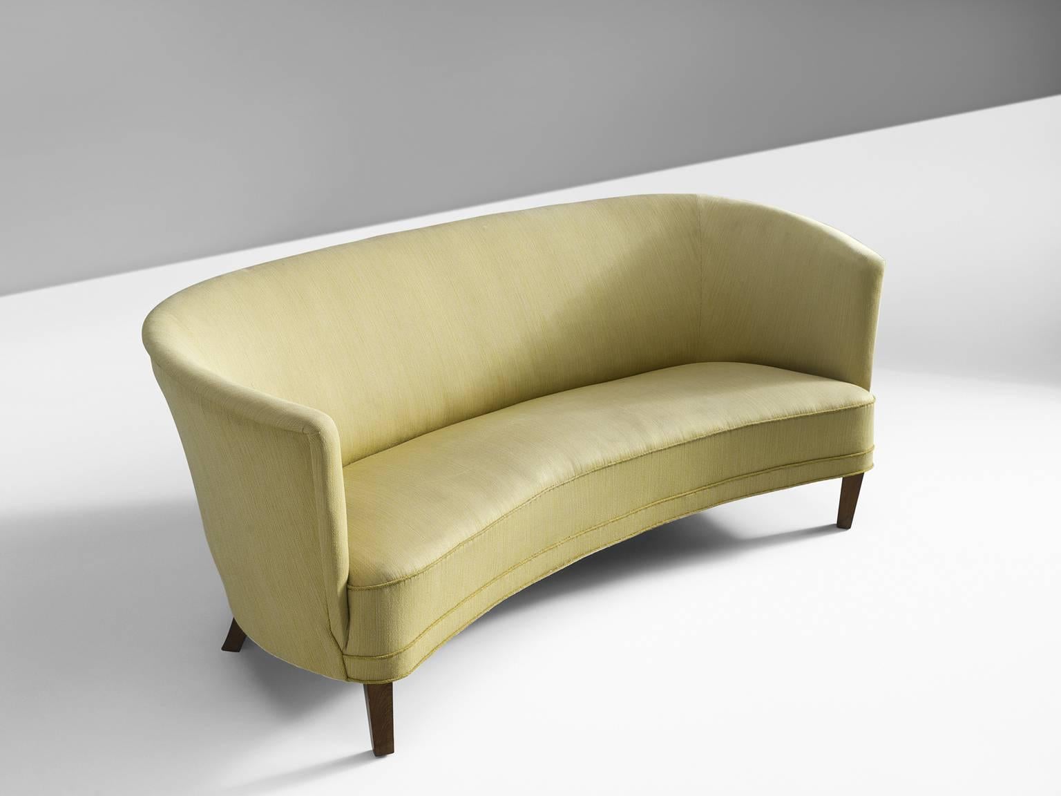 Sofa, fabric and wood, Denmark, 1950s.

Simplistic Swedish sofa with clean lines and a high back. The sofa features small tapered wooden legs. The seat is thick and comfortable and is finished with piping. The high back embraces the sitter in