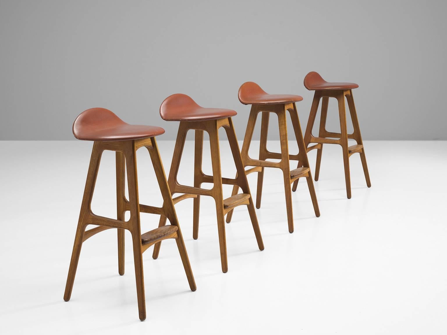 Erik Buch for O.D. Mobler, bar stools, teak and cognac to brown-red leather, Denmark, circa 1960s.

Distinctive set of four barstools by Erik Buch (1923-1982). Buch had over 30 commercially successful production designs over his career but none so