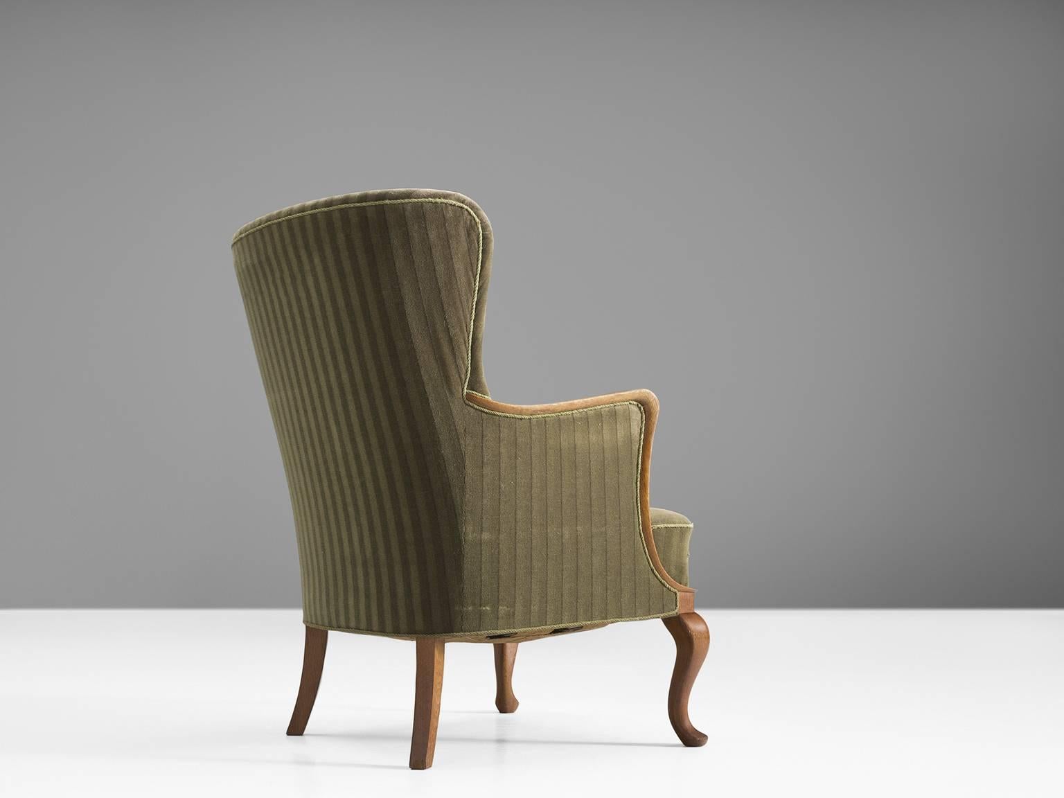 Scandinavian Modern Danish Saber Leg Wingback Chair in Green Upholstery