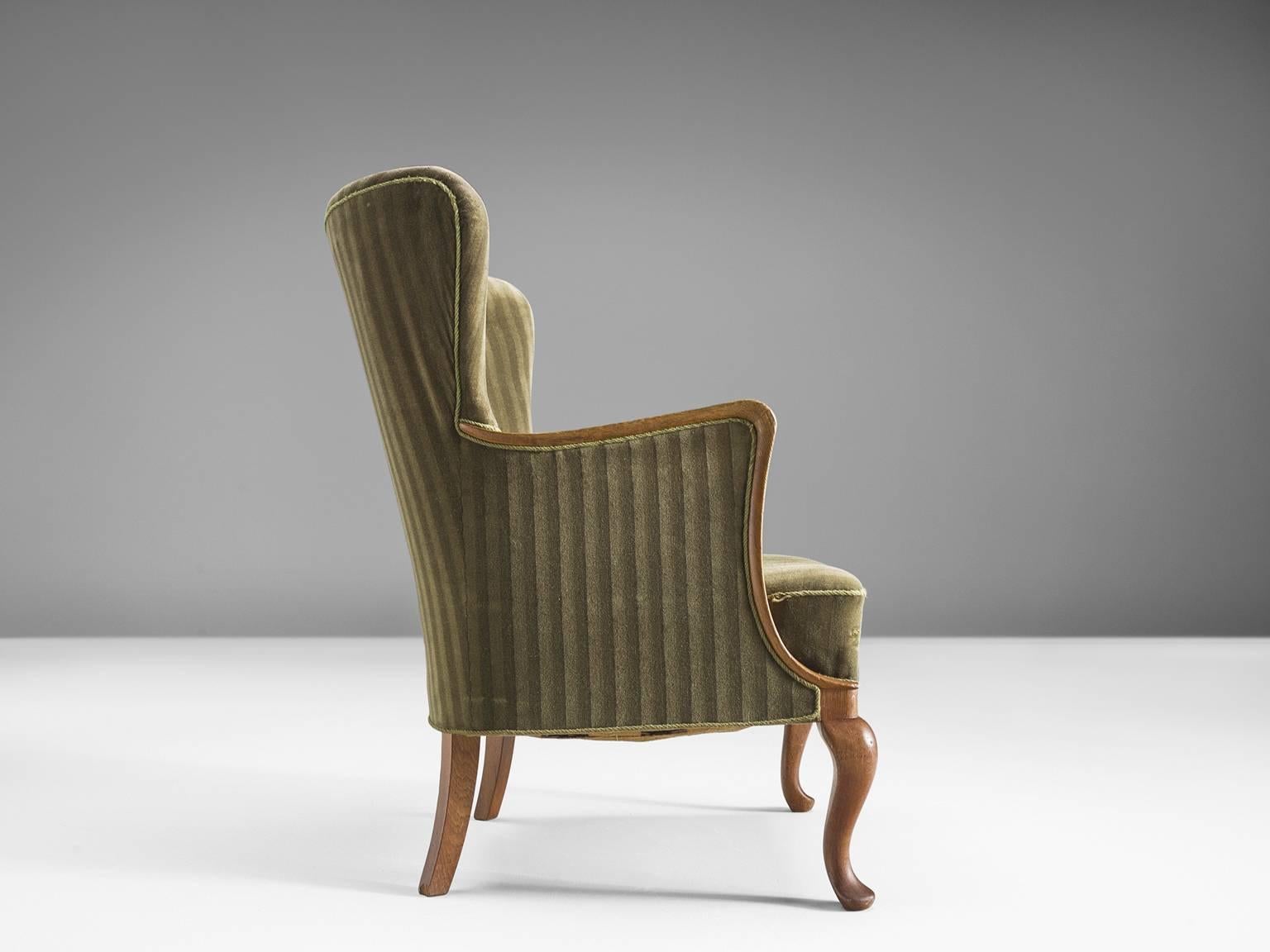 Mid-20th Century Danish Saber Leg Wingback Chair in Green Upholstery