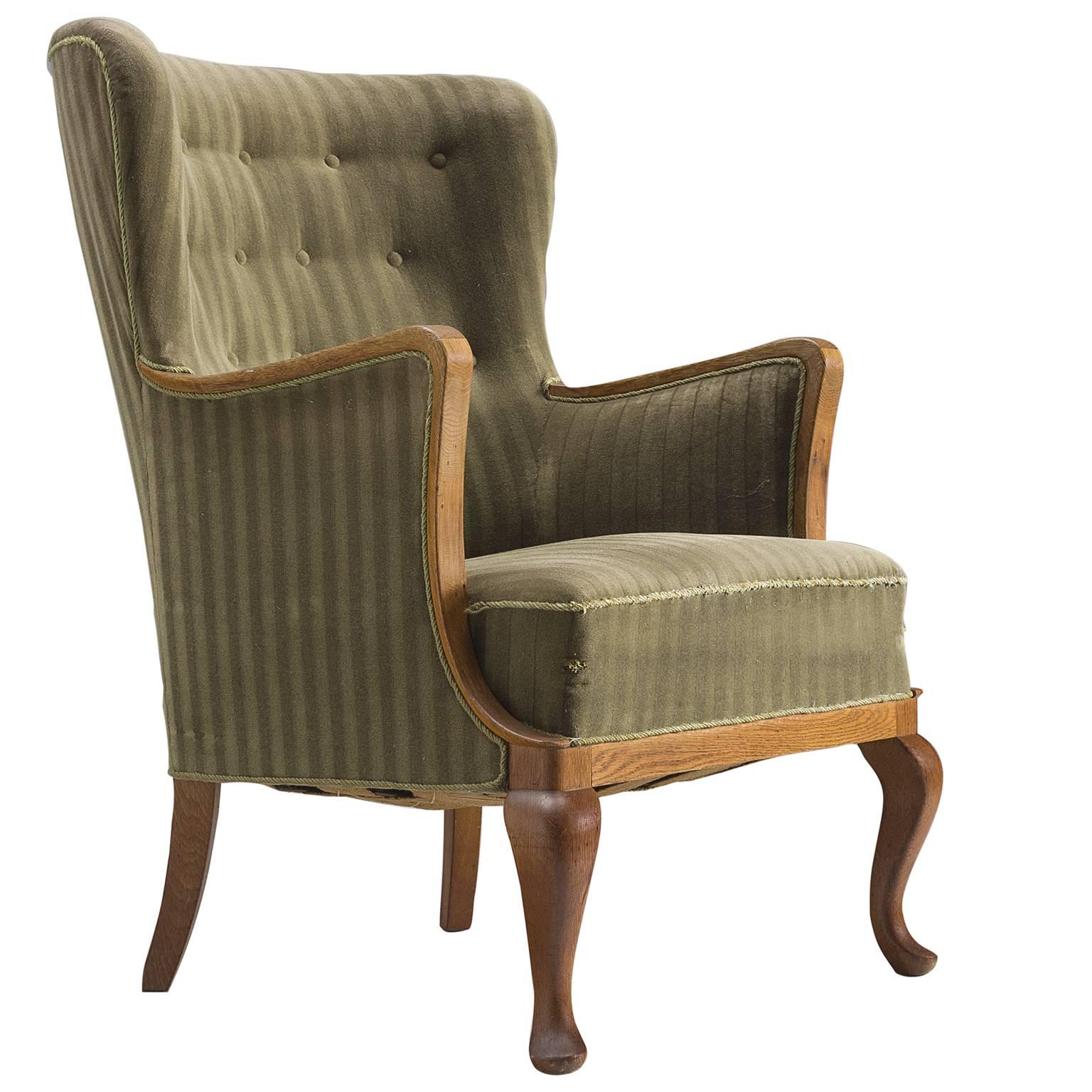 Danish Saber Leg Wingback Chair in Green Upholstery