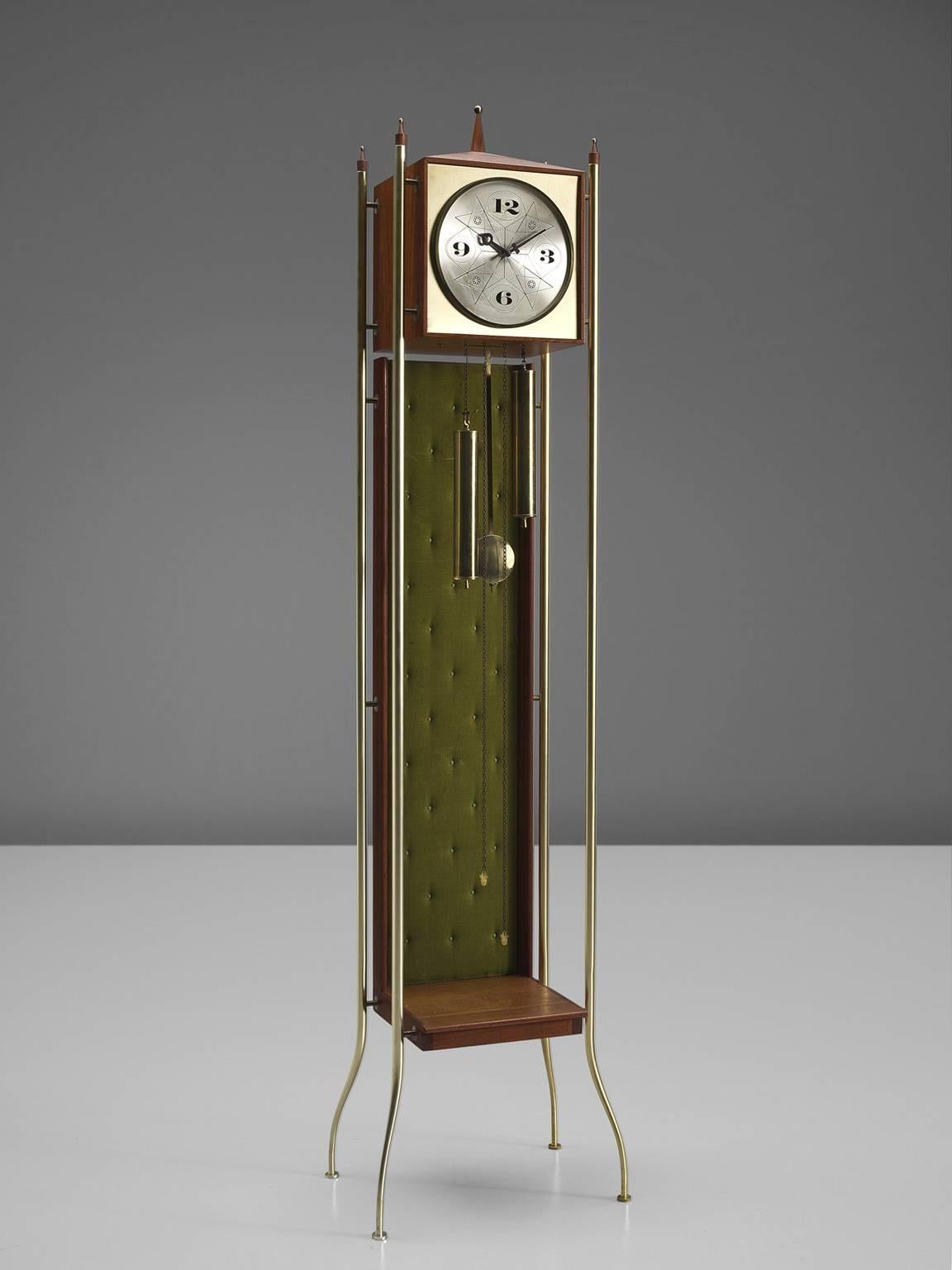 Grandfather clock, silver dial, black numerals and hands, teak wood with padded green velvet-covered background section, New York, 1957. 

This elegant grandfather clock by George Nelson is produced by Howard Miller.
The model is chain driven and