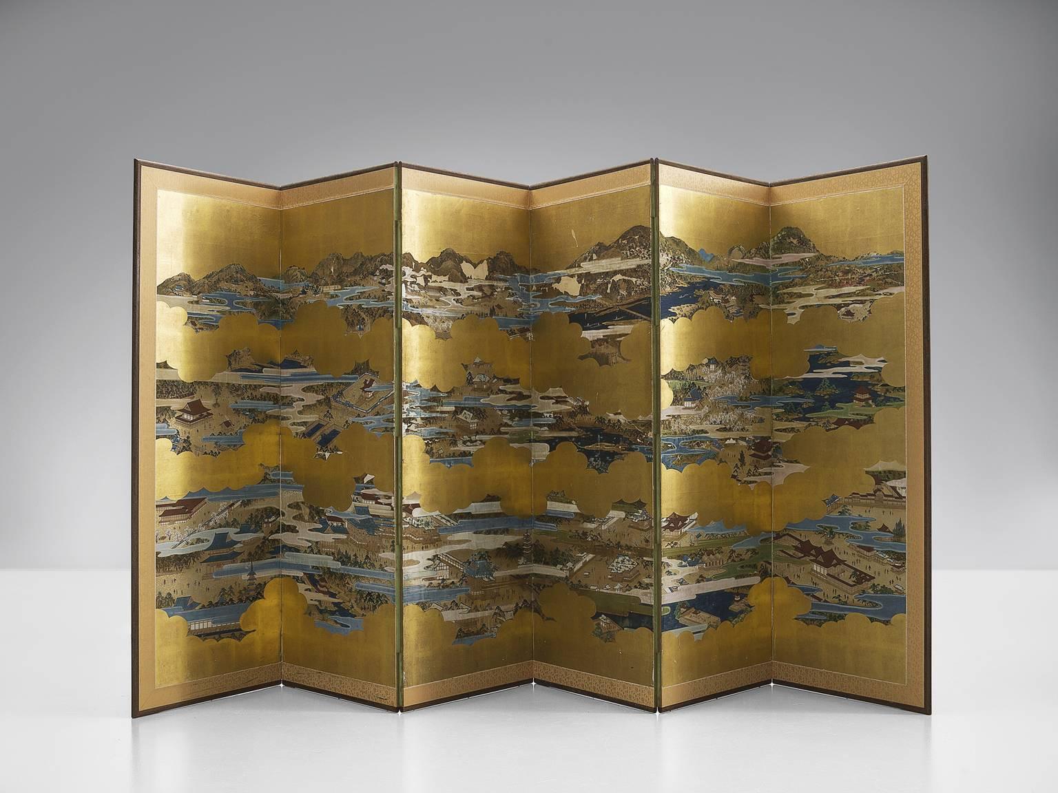 Room divider, gold leaf paper with oriental drawing, cardboard, 1940s.

This splendid screen features a shimmering side with gold leaf and a side with a blue geometric decoration. The screen has three folding lines which is useful in order to