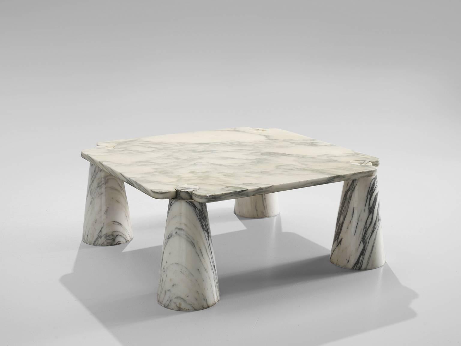 Cocktail table by Angelo Mangiarotti, marble, 1970s. 

This sculptural table by Angelo Mangiarotti is a skillful example of postmodern design. The square table features no joints or clamps and is architectural in its structure. The table rests on