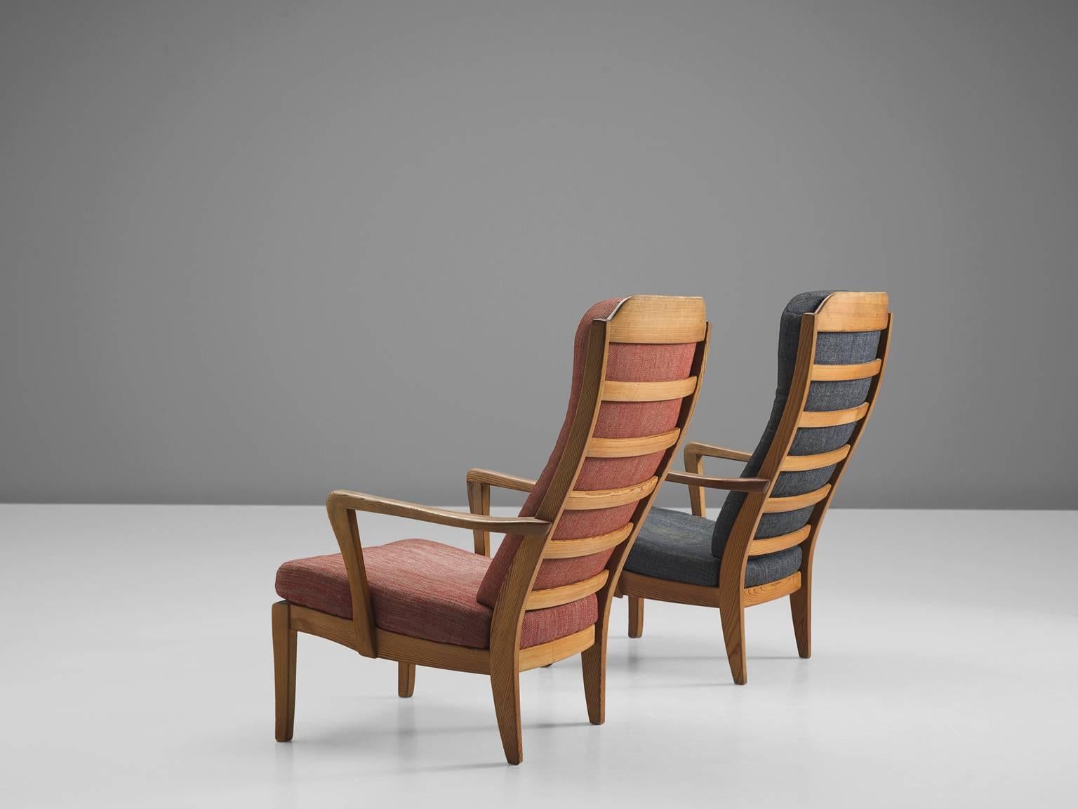 High back easy chairs, pine and original fabric, Sweden, 1943.

The two stately frames of this set of high back chairs bear the archetypical traits of the designs by the Swede Carl Malmsten. The frame, executed in pine, shows the typically