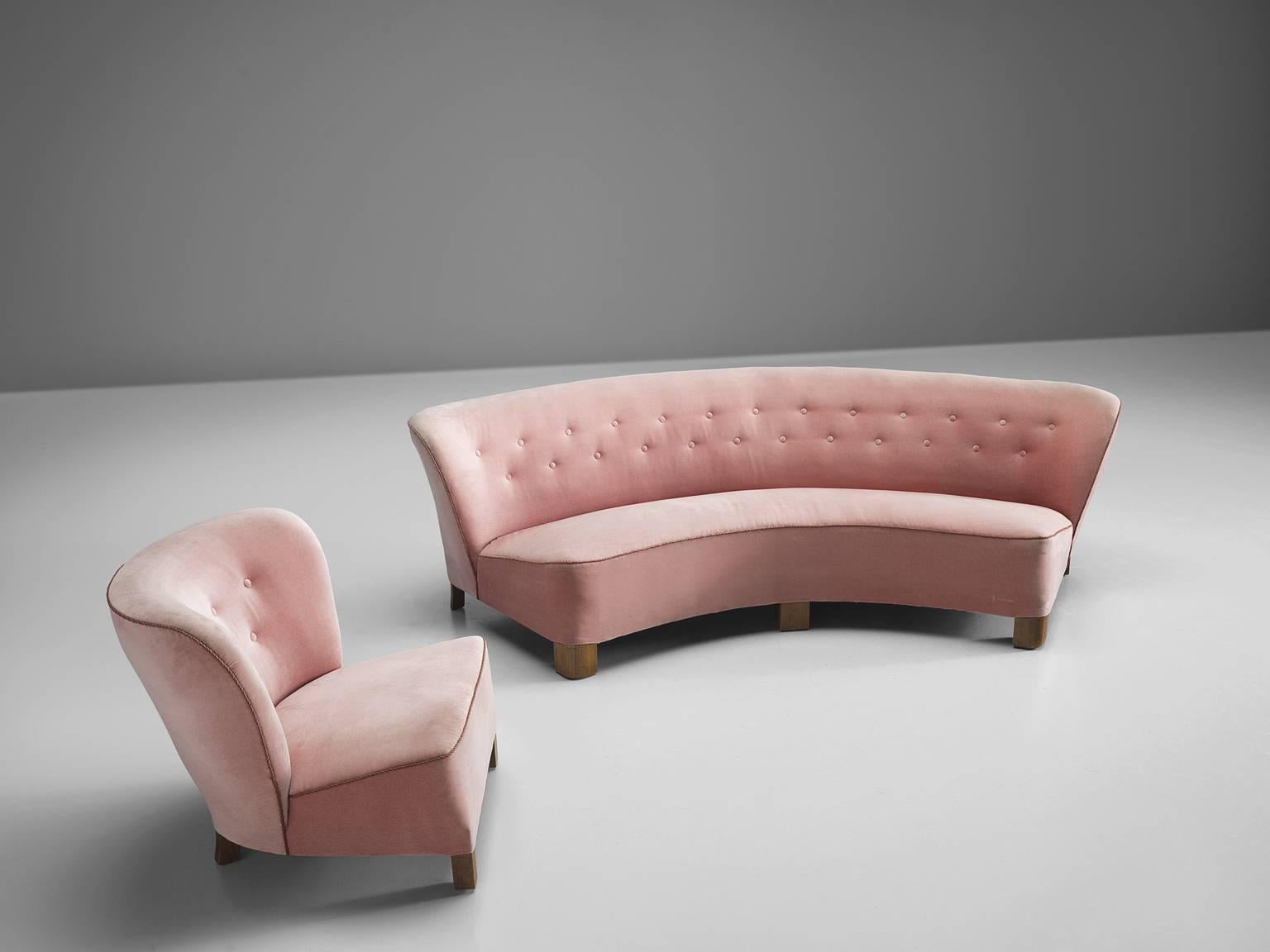 Living room set by Otto Færge, pink fabric, wooden legs, Denmark, 1940

This elegant, curved settee features two quilted lines in the sofa's back. The same design is used in the lounge chair that has a slightly tilted back for maximum comfort. The