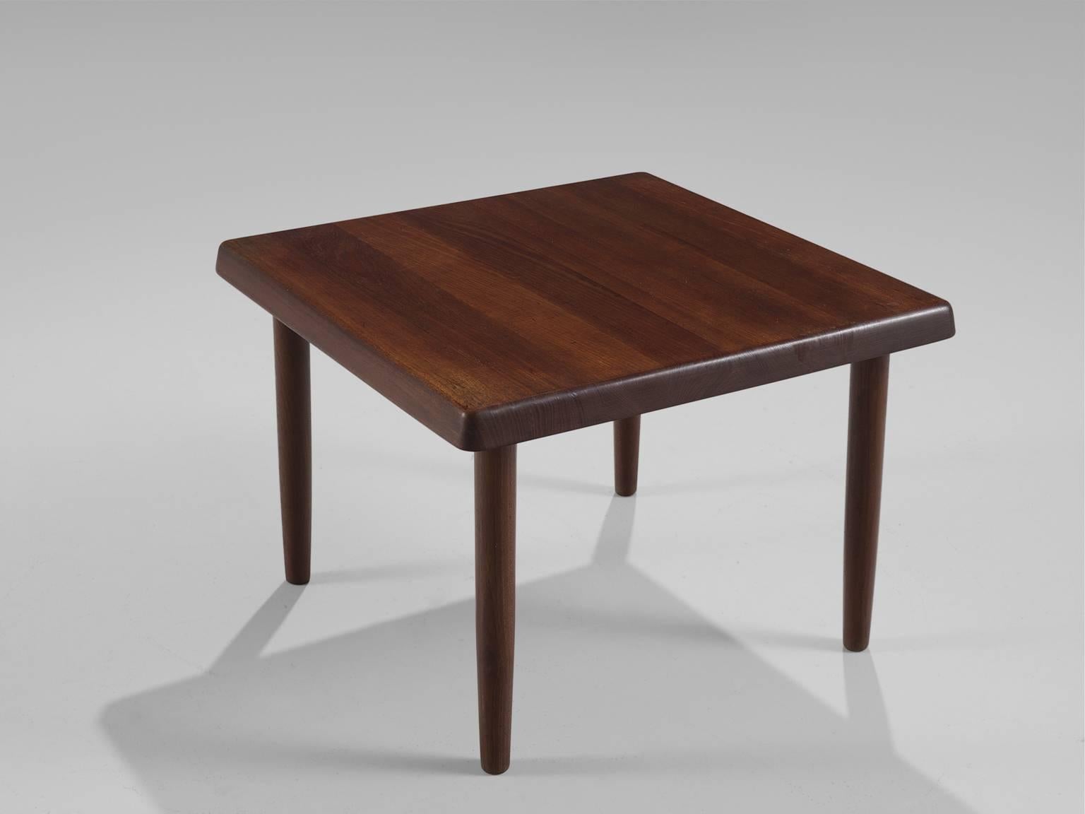 Coffee table, solid teak, Denmark, 1950s

This square coffee or side table table is an example the elegant midcentury Danish design. The top features soft edges and warm, orange to red colored teak with a very nice contrasting grain. The four