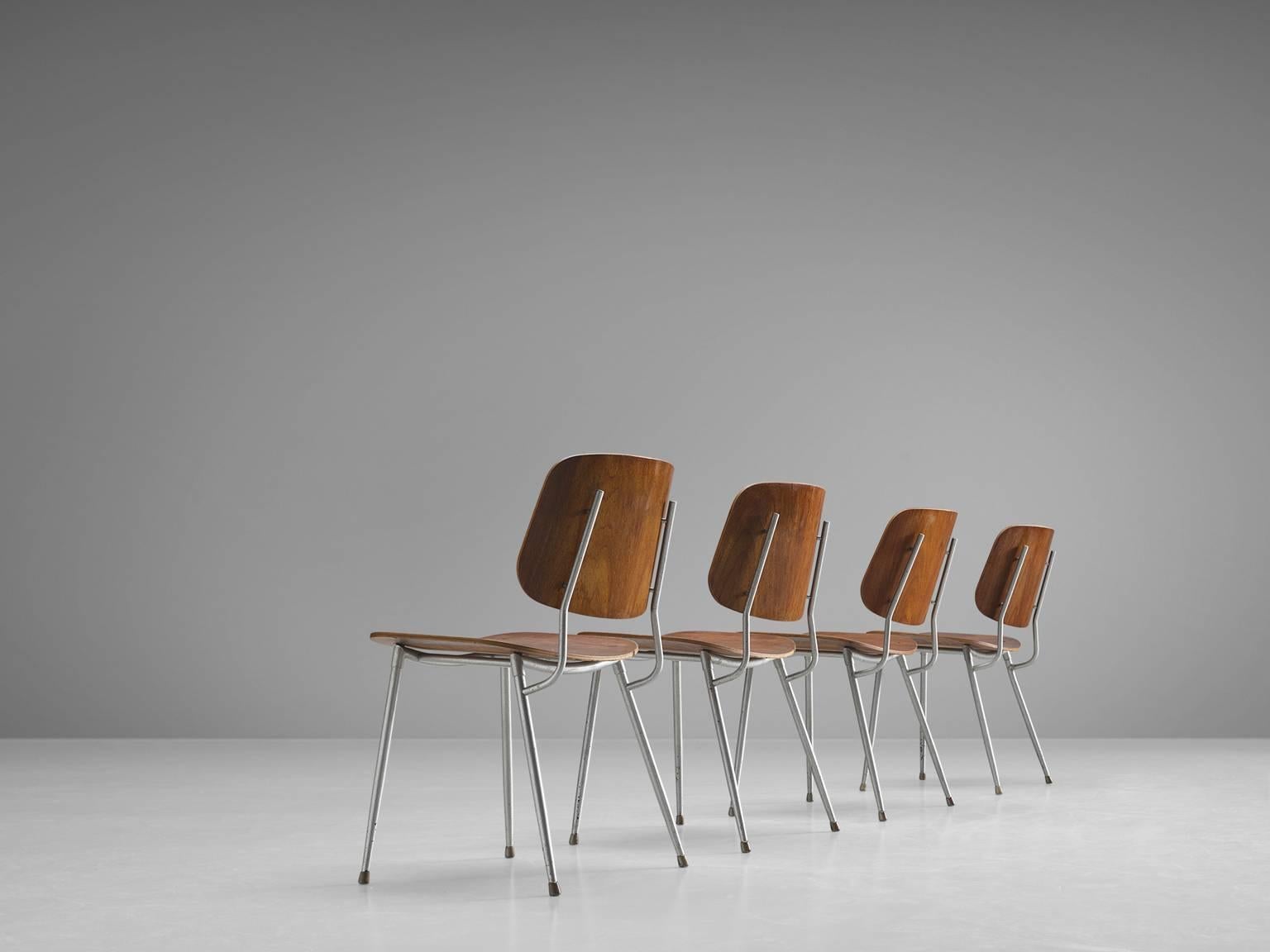 Dining chairs by Børge Mogensen for Søborg Furniture, teak, steel, Denmark, 1953

This set of four Søborg chairs feature a slender steel frame with molded teak seat and back. The chair consists of two wide and slightly curved shells, constituting