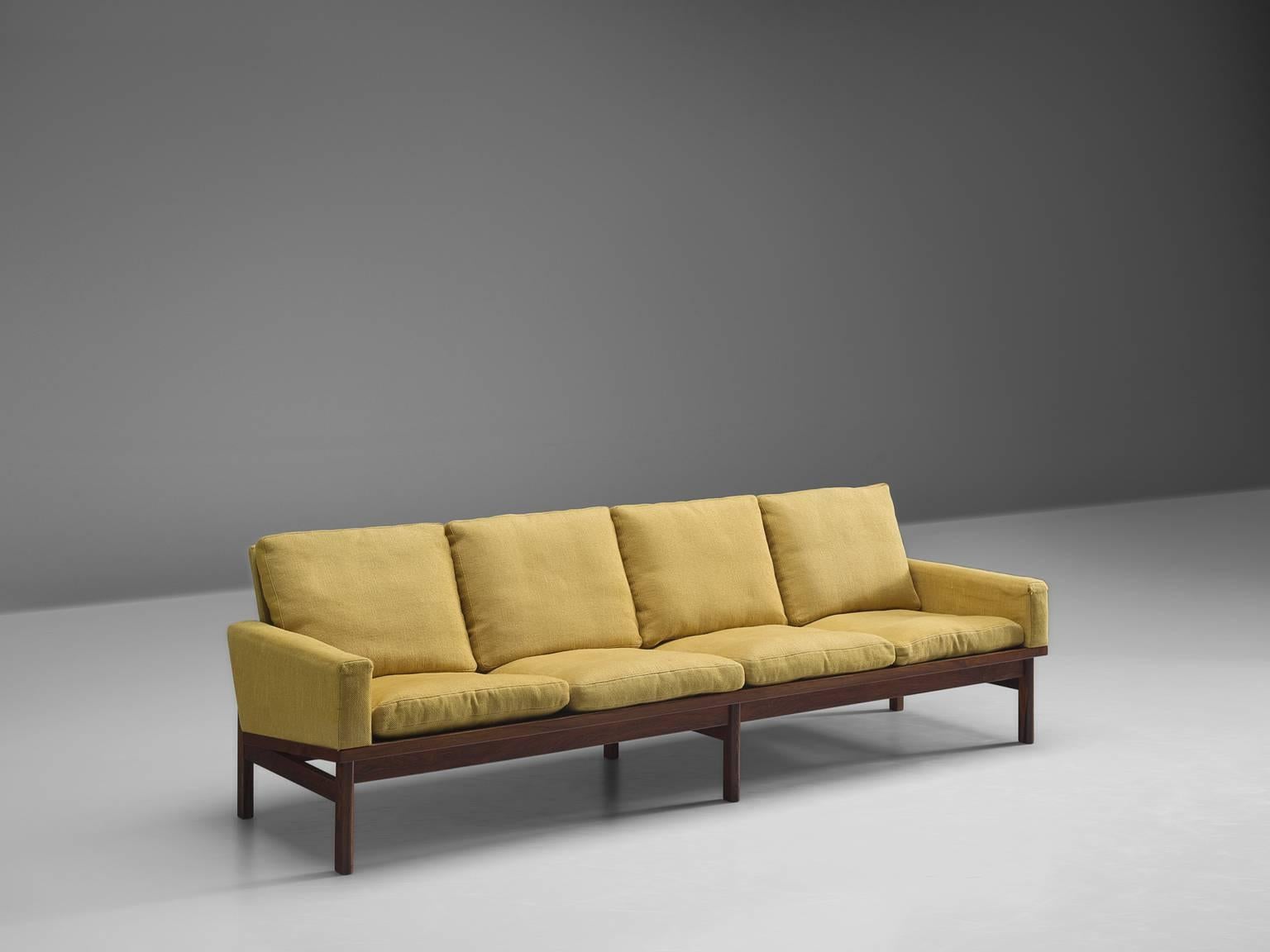 Settee, fabric and dark grained wood, Denmark, 1960s

This high quality sofa features thick cushions and a simplistic, geometric solid wooden frame. The sofa has eight legs and a tilted backrest in order to provide maximum comfort. Due to the high