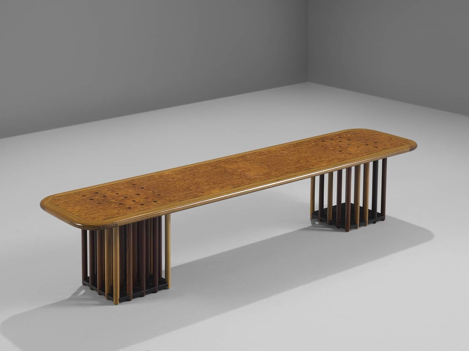 Coffee table by Afra Scarpa and Tobia Scarpa, maple burl, birch, beech, oak, fruitwood, Italy, circa 1975

This extraordinary long table features two feet that exist of circular rods made out of different types of wood. The ends of the circular