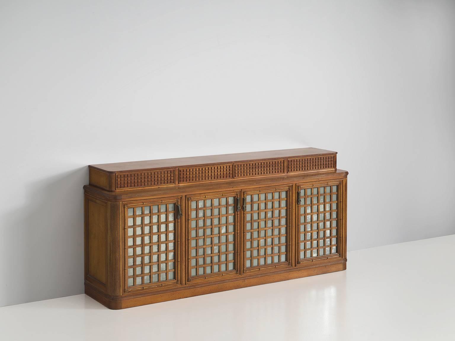 Sideboard, in walnut, bamboo and glass, for Giorgetti, Italy, 1970s.

Beautiful detailed Italian credenza. This cabinet consist of two levels. The large storage compartment, with four doors and a top level with four drawers. All elements on this