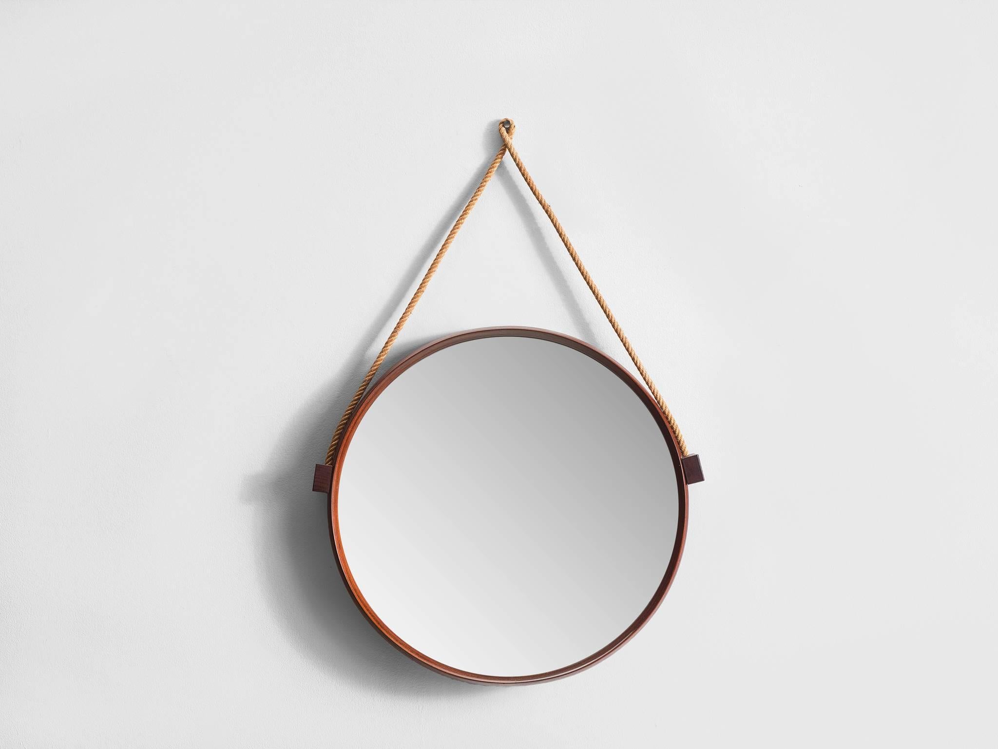 Mid-Century teak and rope mirror, Italy, 1960s

A nice Mid-Century round teak mirror suspended from a thick cotton braid cord. The mirror has sharp organic lines and beautiful jointing on the teak edge and it is perfectly distressed from age.