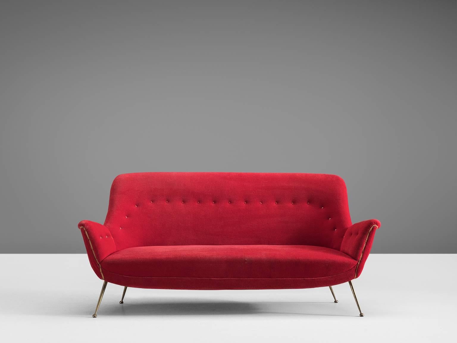 Gorgeous Venetian red Italian sofa original from the 1950s.

This sofa is an iconic example of Italian design from the 1950s. Organic and sculptural, this two-and-a-half-seat sofa is anything but minimalistic. Equipped with the original stiletto