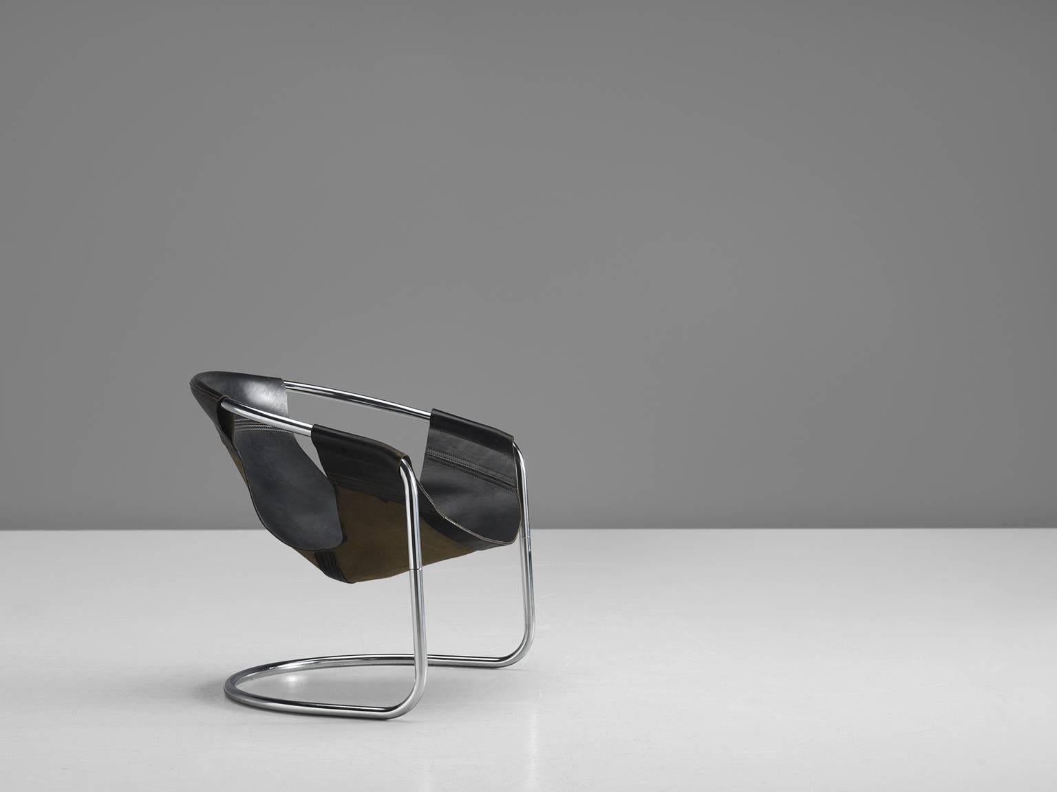 Chair, black leather and chrome, 1965, The Netherlands.

This brown leather chair is both geometric and rustic in its style. The lounge chair was designed by Clemens Claessen for Ba-as Eindhoven in 1965. These chairs were made on a very small-scale