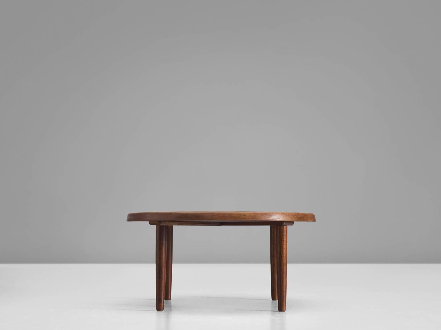 Side table, solid teak, Denmark, 1950s

This circular side table is an example of Danish design with modest aesthetics and executed in solid teak. This makes this table different from other tables that are often veneered. The top features soft edges