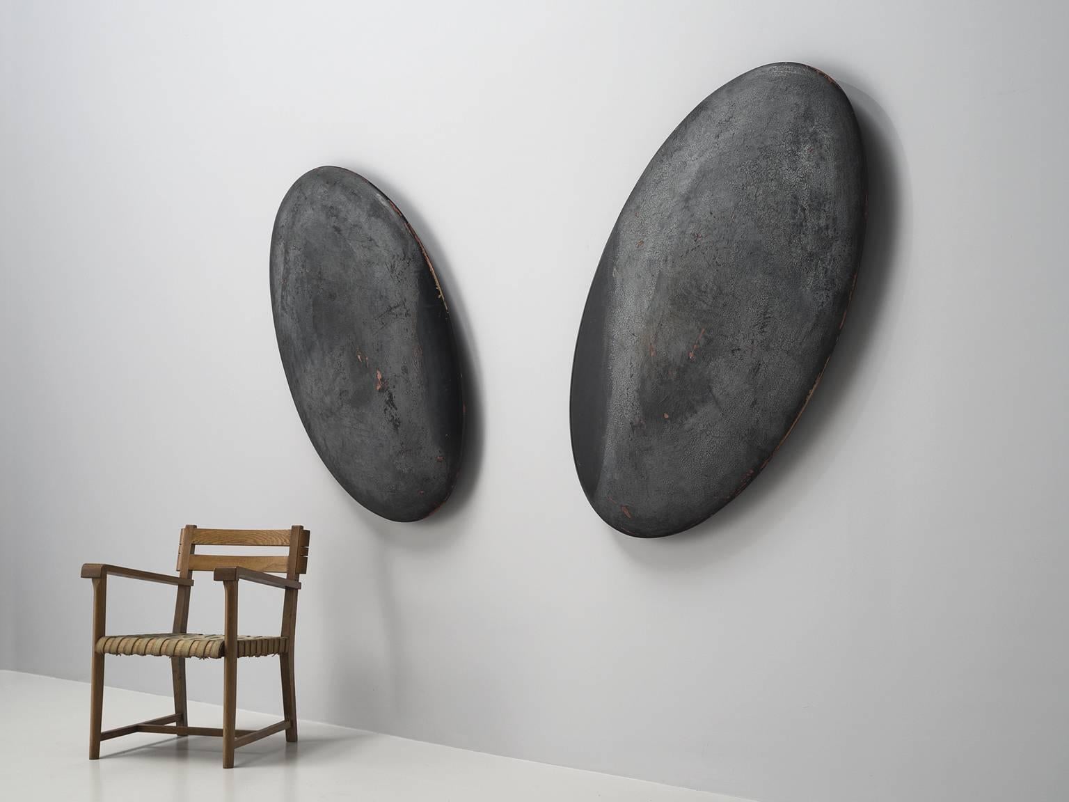 Set of two oval wall objects, Europe, 1960s.

This set of organic oval shaped pieces are very textural. The pieces feature a stone like color and texture. The pieces are most likely from the 1960s seeing the traits of minimalism and the abstract