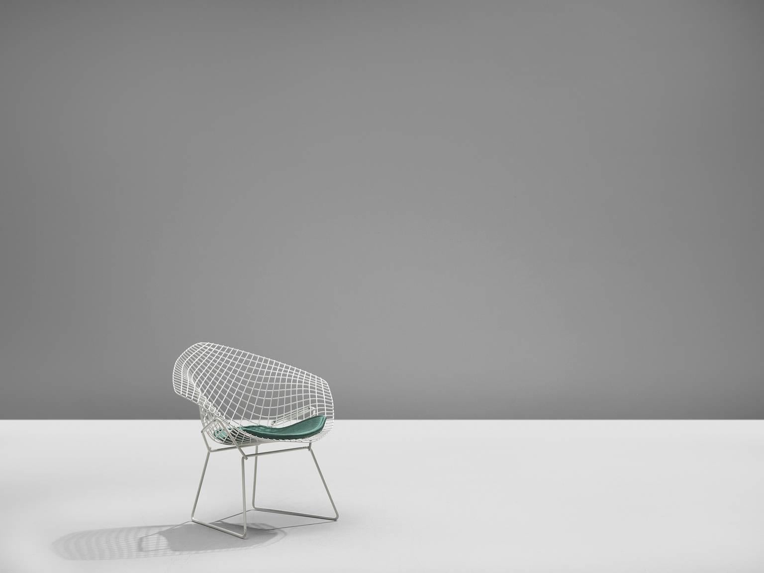 'Diamond' chair by Harry Bertoia for Knoll, white coated metal, turquoise cushion, 1950s (later production)

The Diamond Chair is, according to Knoll, an astounding study in space, form and function by one of the master sculptors of the last