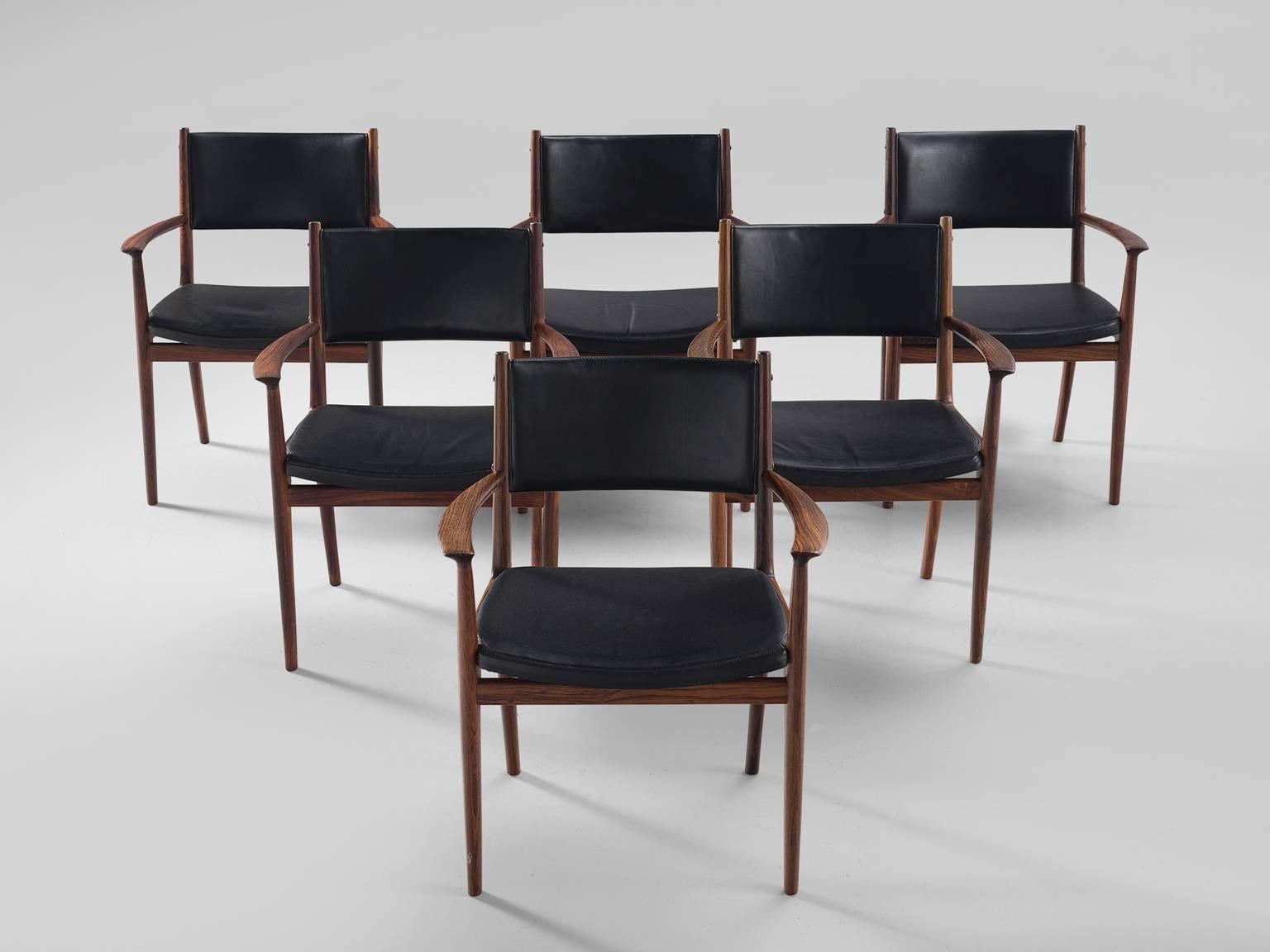 Kai Lyngfeldt Larsen for Soren Willadsen, set of six dining chairs in rosewood and black leatherette, Denmark, 1960s.

These comfortable dining chairs show wonderful craftsmanship. The black faux leather upholstery has aged in a beautiful way. The