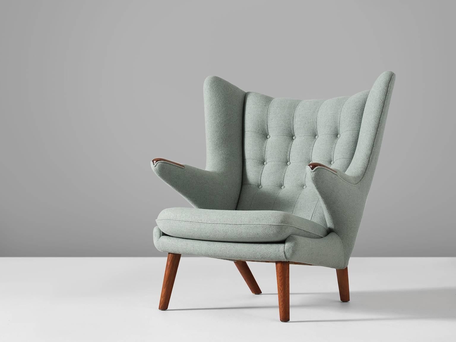 Lounge chair Model AP 19 'Papa Bear' designed by Hans J. Wegner, manufactured by AP Stolen, Denmark, 1951 design, production late 1950s, reupholstery by Morentz.

This semi-wingback armchair, has an open expression in contrast with its historical