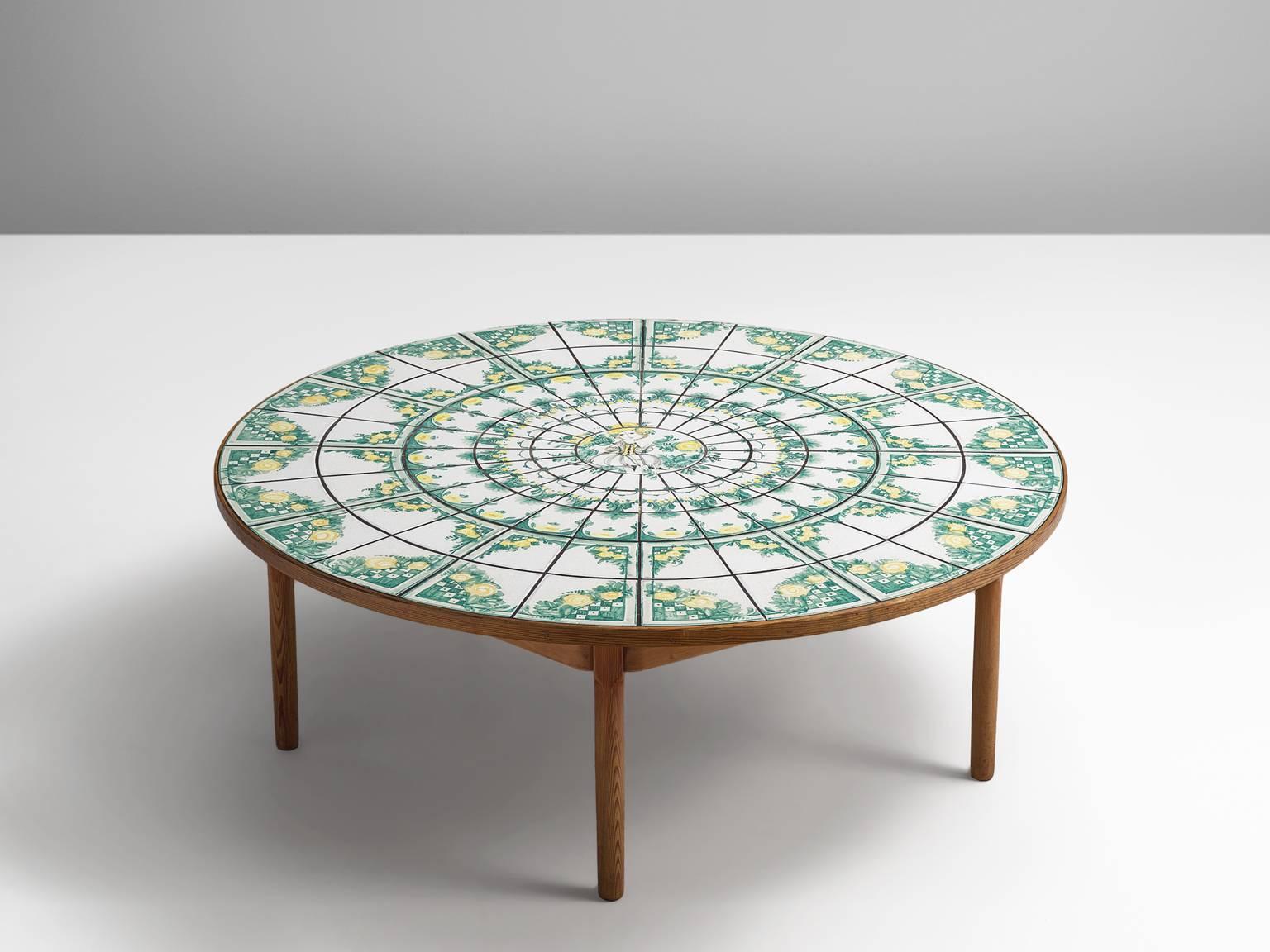 Bjorn Wiinblad, coffee table, faience tiles, wood, Denmark / Germany, 1970s.

This ceramic coffee table is decorated with hand-painted ceramic tiles in twining vines, floral wreaths and trees in green and white. The combination of the natural