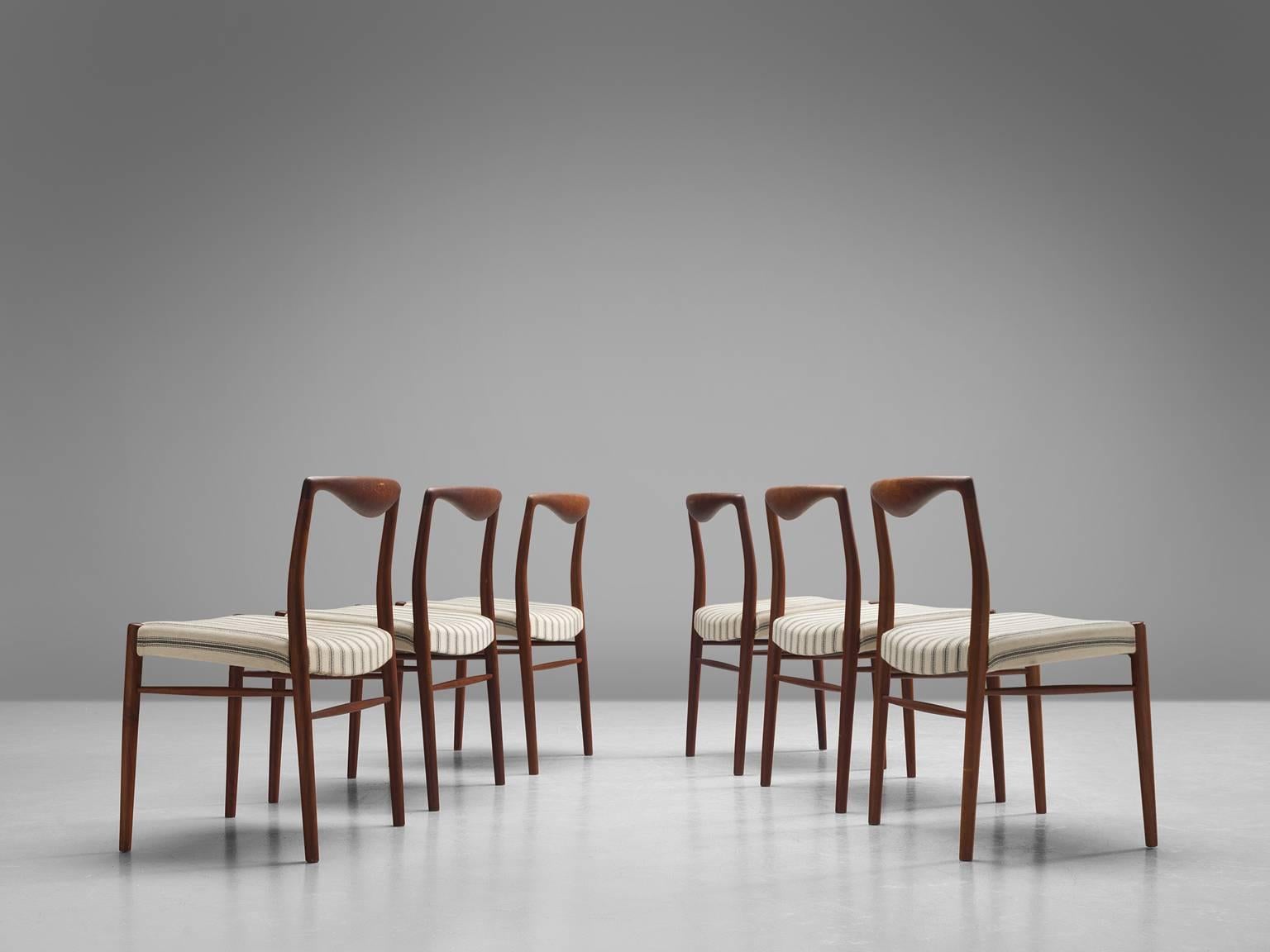 Kai Lyngfeldt Larsen for Soren Willadsen, set of six dining chairs in teak and white to beige fabric, Denmark, 1960s.

These elegant, curvy dining chairs show wonderful craftsmanship. The top rail is formed by a sculptural piece of soft teak that