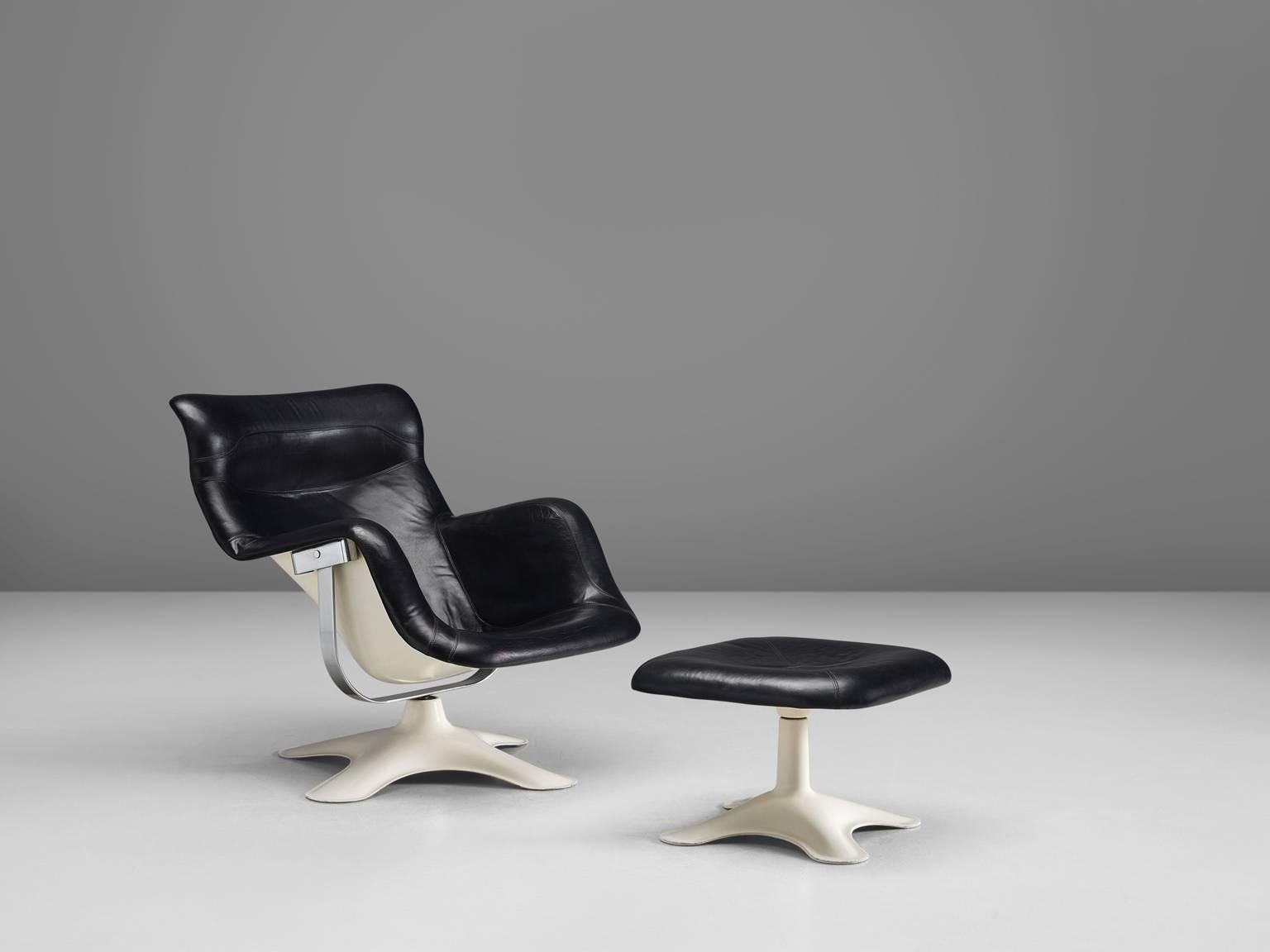 'Karuselli' lounge chair, in black leather, fiberglass and white polyester, by Yrjö Kukkapuro for Haimi, Finland, 1960s.

Organic shaped lounge chair by Finnish designer Yrjö Kukkapuro. This chair consist of a moulded plastic shell with thick