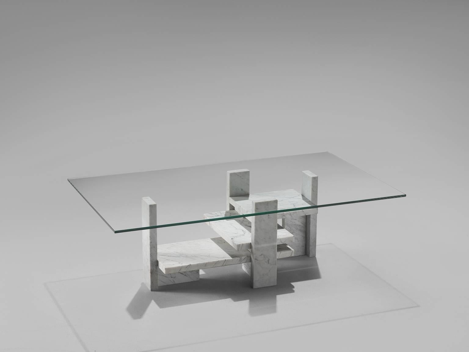 Coffee table, marble, Italy, 1970s. 

This sculptural table is a skillful example of postmodern design. The glass and marble table is architectural in its design. The rectangular table top is executed in glass. As a result, the sculptural,