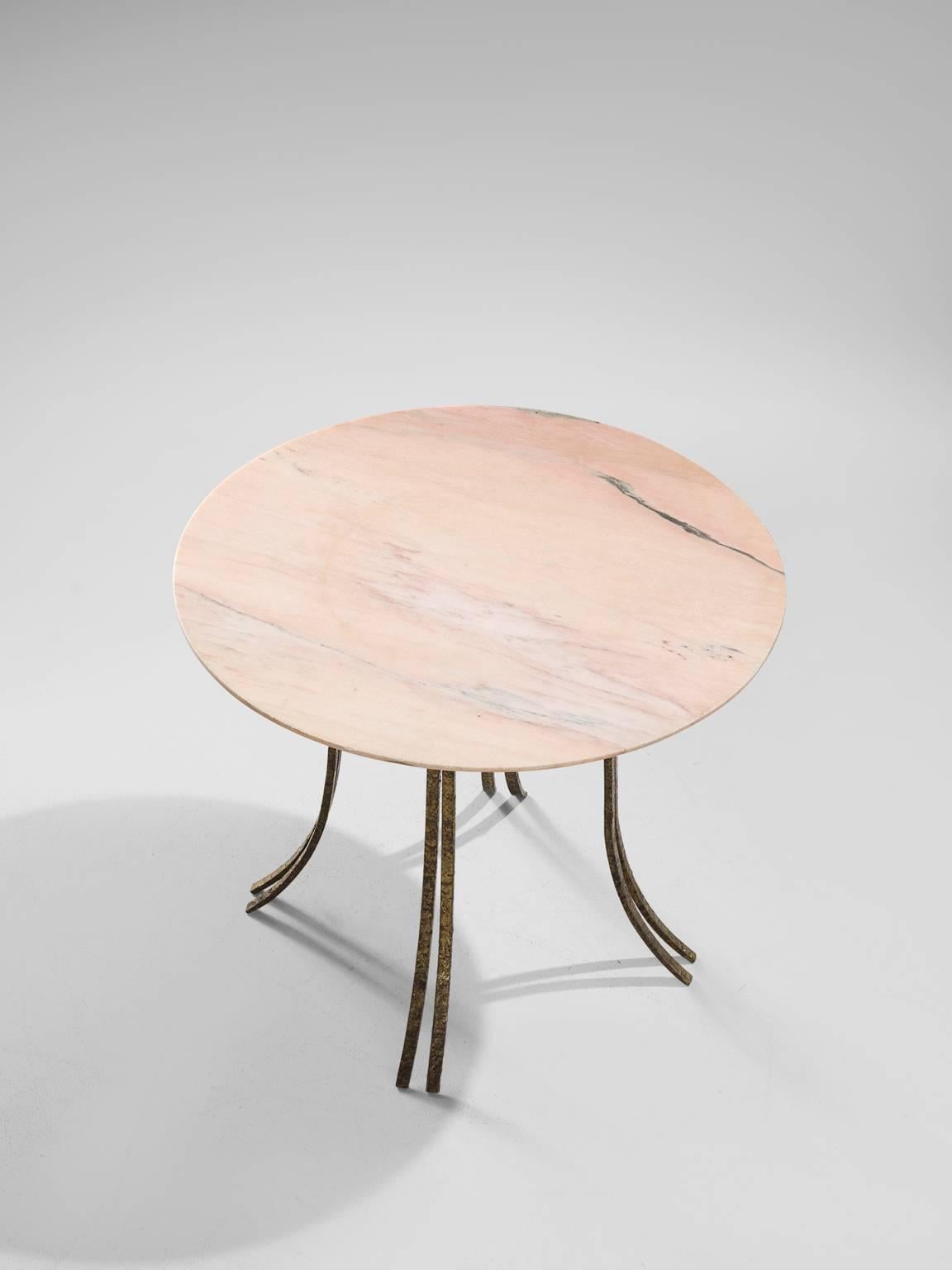 Side table, marble and brass, Europe, 1950s. 

Luxurious circular side table with beautiful organic base. This base is made out of structured brass and each leg divides itself into two 'branches'. The deep, patinated color of the structured gives