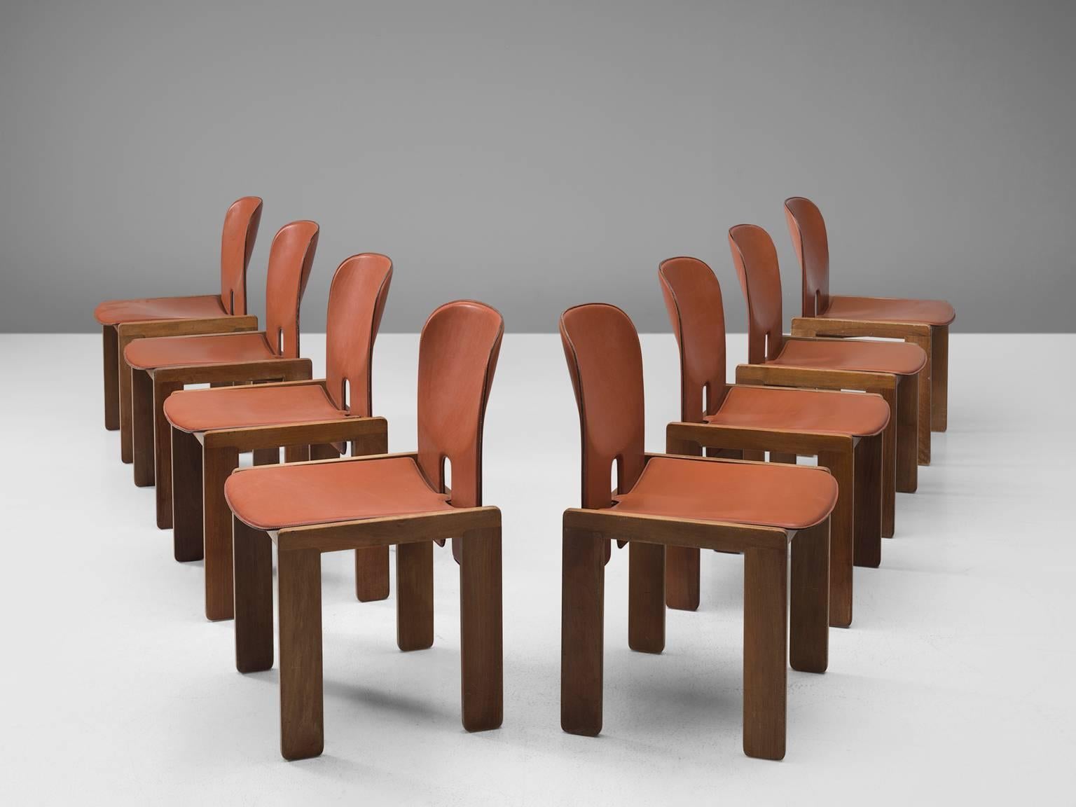 Set of eight chairs model 121, in walnut and cognac leather, by Afra & Tobia Scarpa for Cassina, Italy, 1965.
 
Set of eight chairs by Italian designer couple Tobia & Afra Scarpa. These chairs have a cubic and architectural appearance. The base