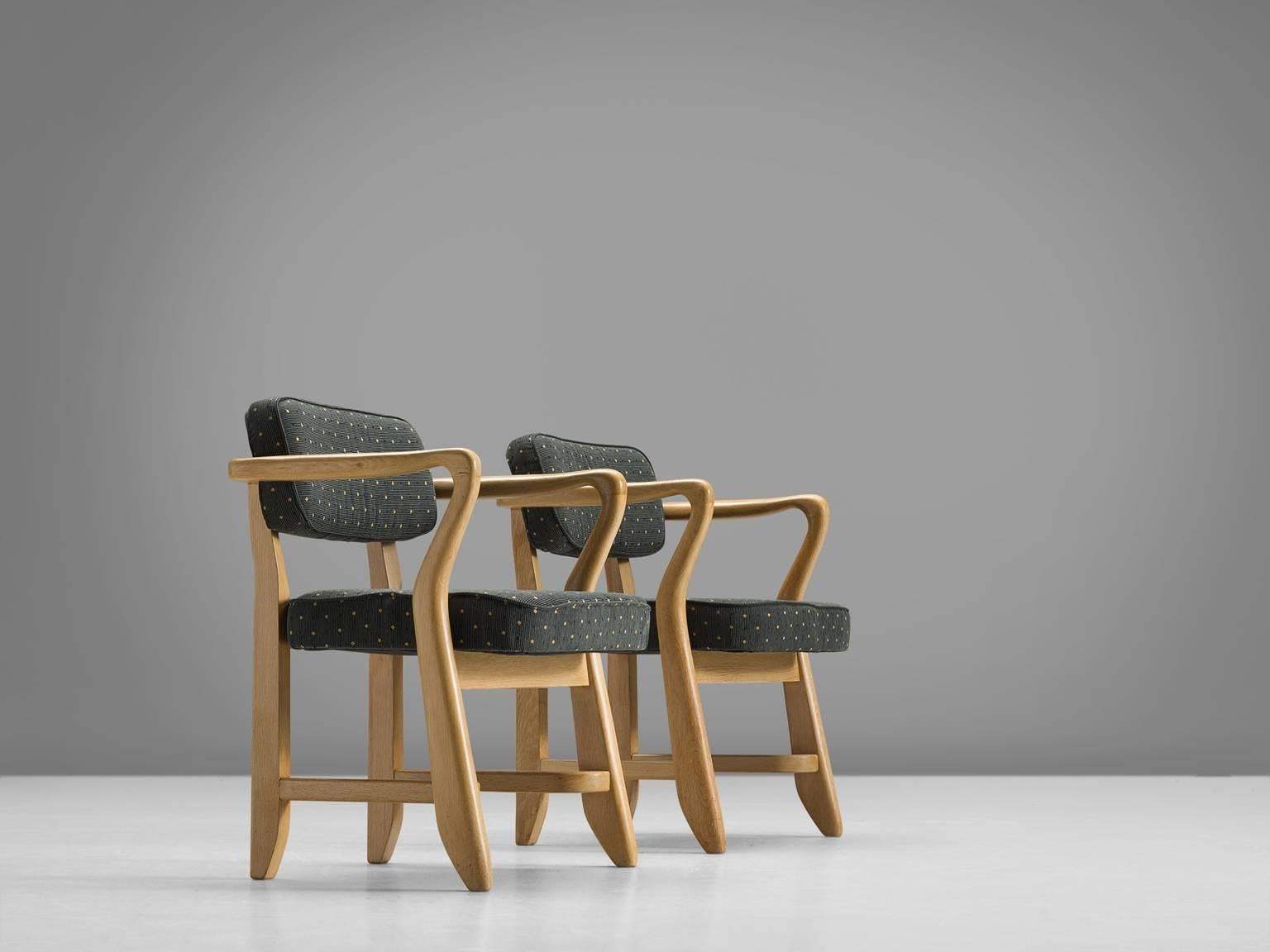 Armchairs, green fabric, oak, France, 1950s

These sculptural easy chair are designed by Guillerme and Chambron. The duo is known for their high quality solid oak furniture. These sculptural armchairs have an interesting open construction, featuring