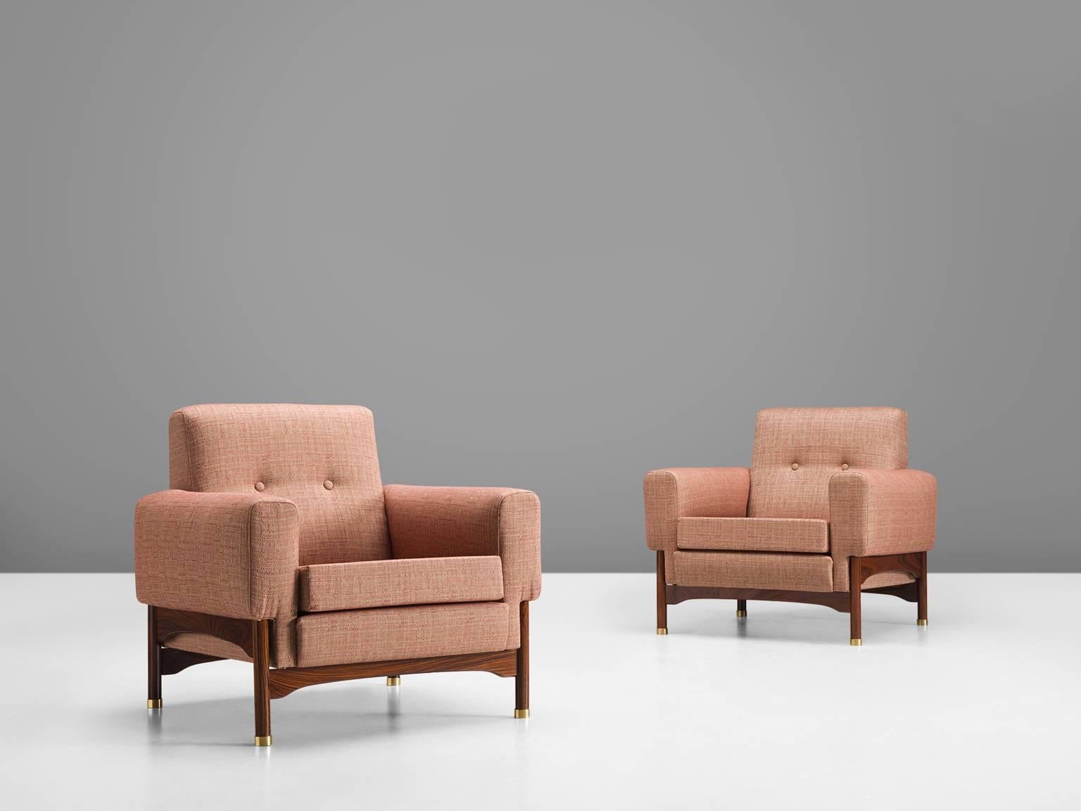 Pair of lounge chairs pink upholstery, rosewood, Italy, 1960s.

This elegant, geometric pair of lounge chairs feature a muted pink upholstery. Eloquent detail is the slight curve on upper side of the frame and the brass feet. The armrests stand