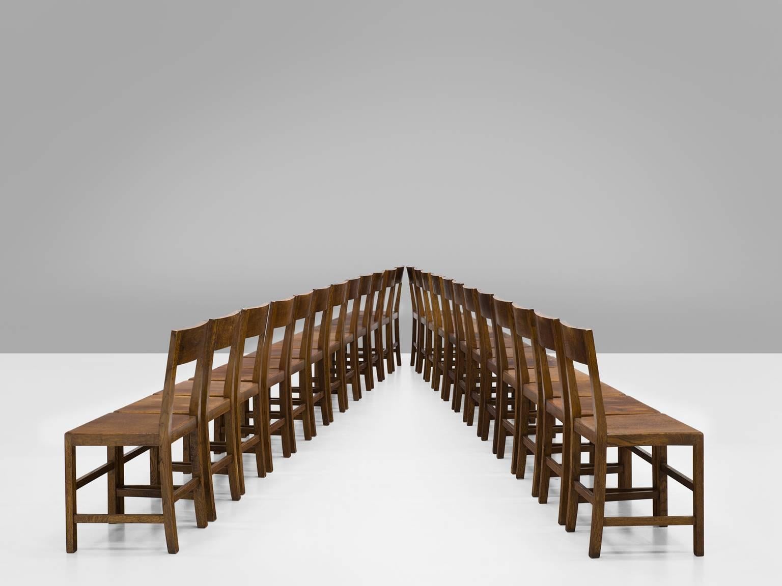Large set of chairs, oak, Belgium, 1940s.

Large set of chairs are executed in aged oak. The chairs have a very solid and geometric backrest. The chairs are both functional and clear in their design, as is common of most Belgian design. The design