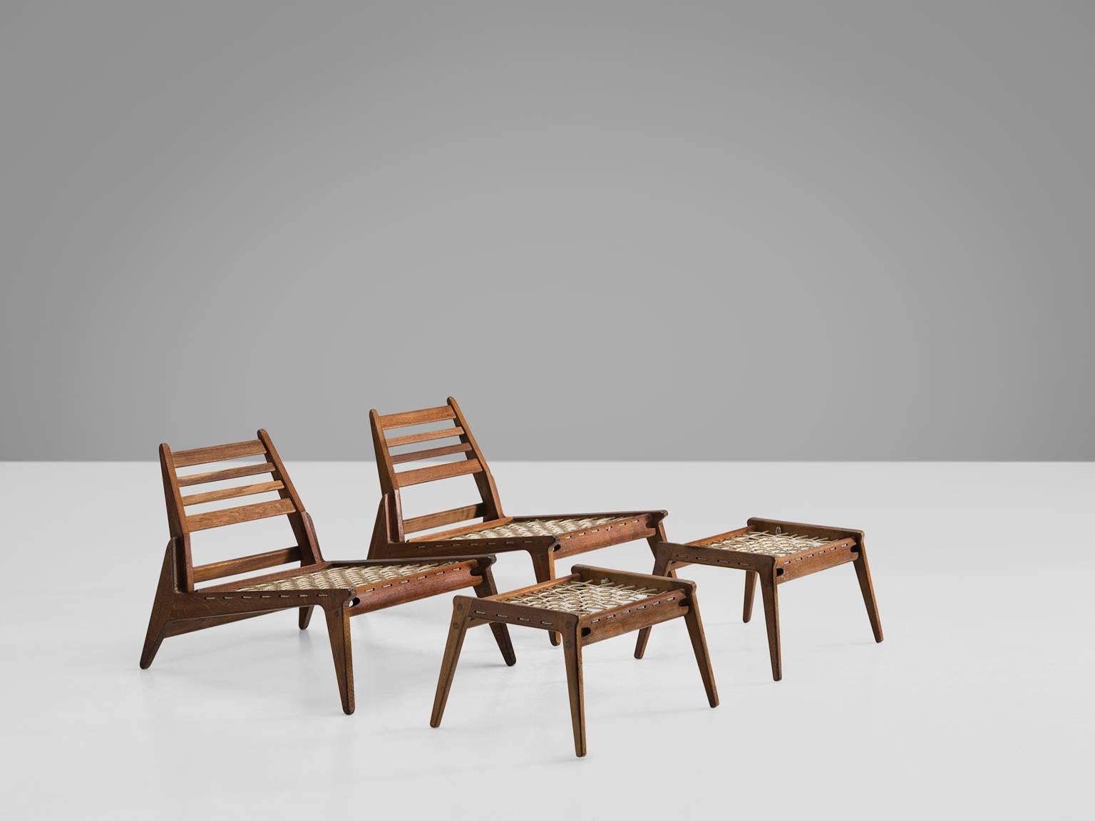 Pair of lounge chairs with ottomans, in oak, Germany, 1950s. 

Set of two modular chaise longue, existing of a lounge chair and ottoman. These relaxing hunting chairs show a basic minimal design with great woodworking. An open character is created