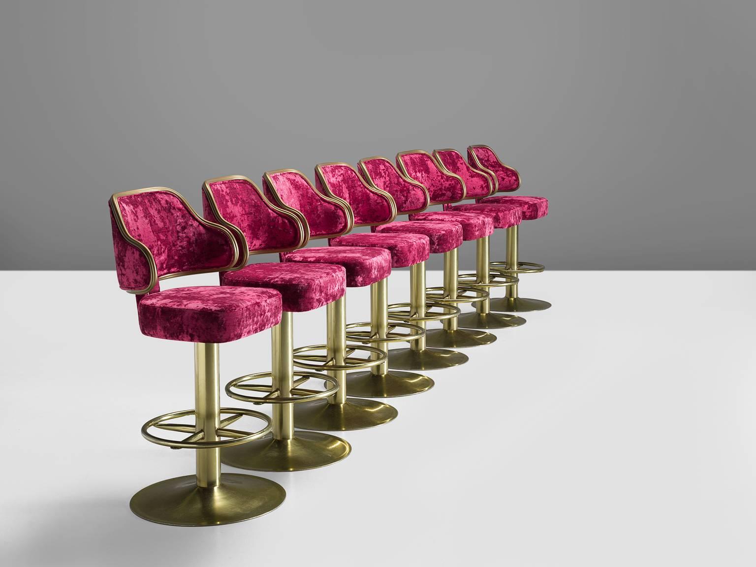 Bar stools, metal, pink velvet, Europe, design 1980s, newly upholstered 2017.

This extraordinary set of classic Casino barstools is upholstered with a deep pink colored velvet on a gold colored metal base. The stools serve as a playful reference
