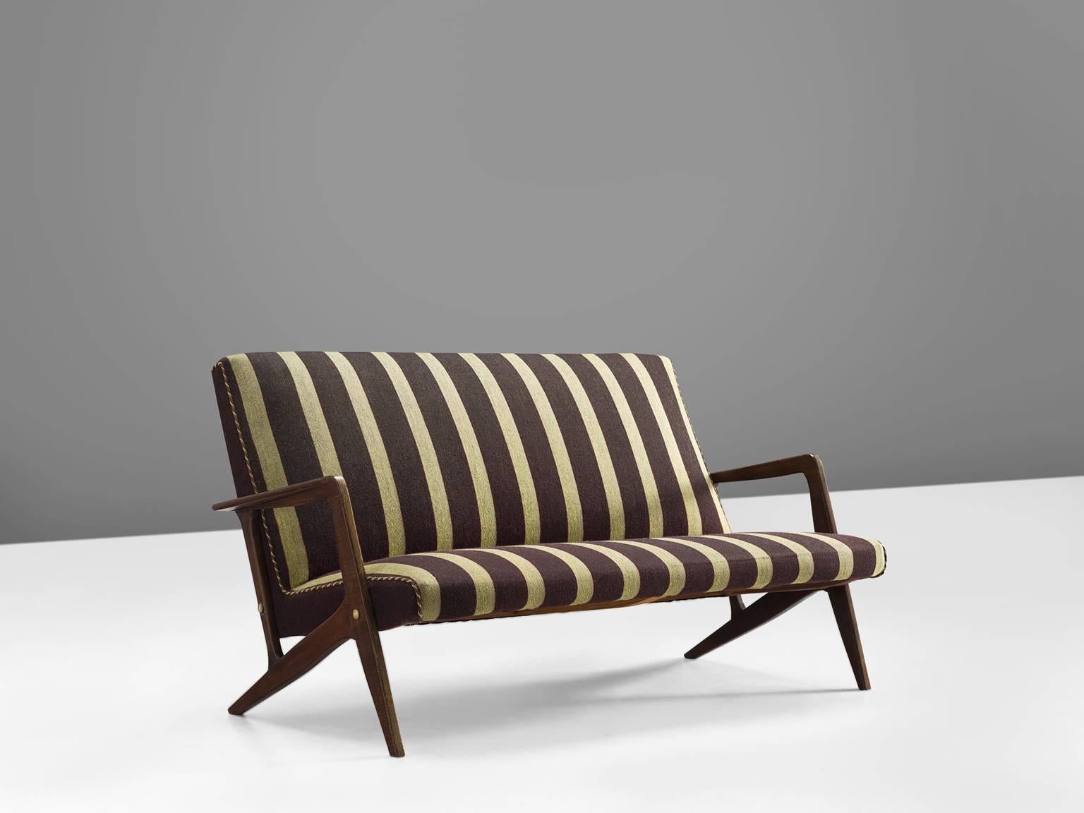 Sofa, in wood and striped brown and green fabric, Scandinavia, 1950s. 

Small reclining sofa with organic shaped wooden base. The eye catching element is the wooden, almost branch-like frame. This organic shaped frame splits into two legs at the end